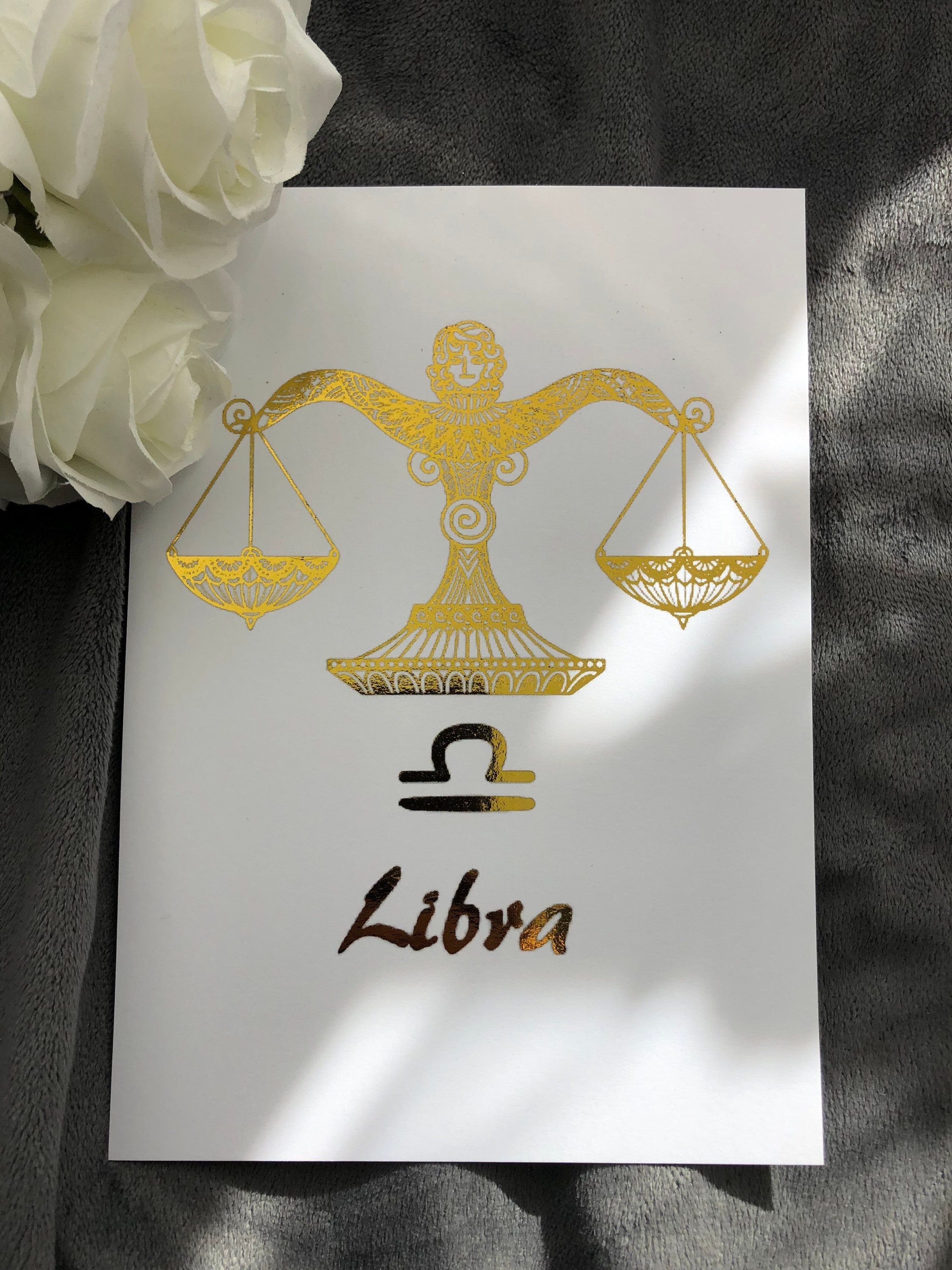 A beautiful Libra Star Sign Foil Print featuring elegant scales design, symbolizing balance and harmony, perfect for home decor.