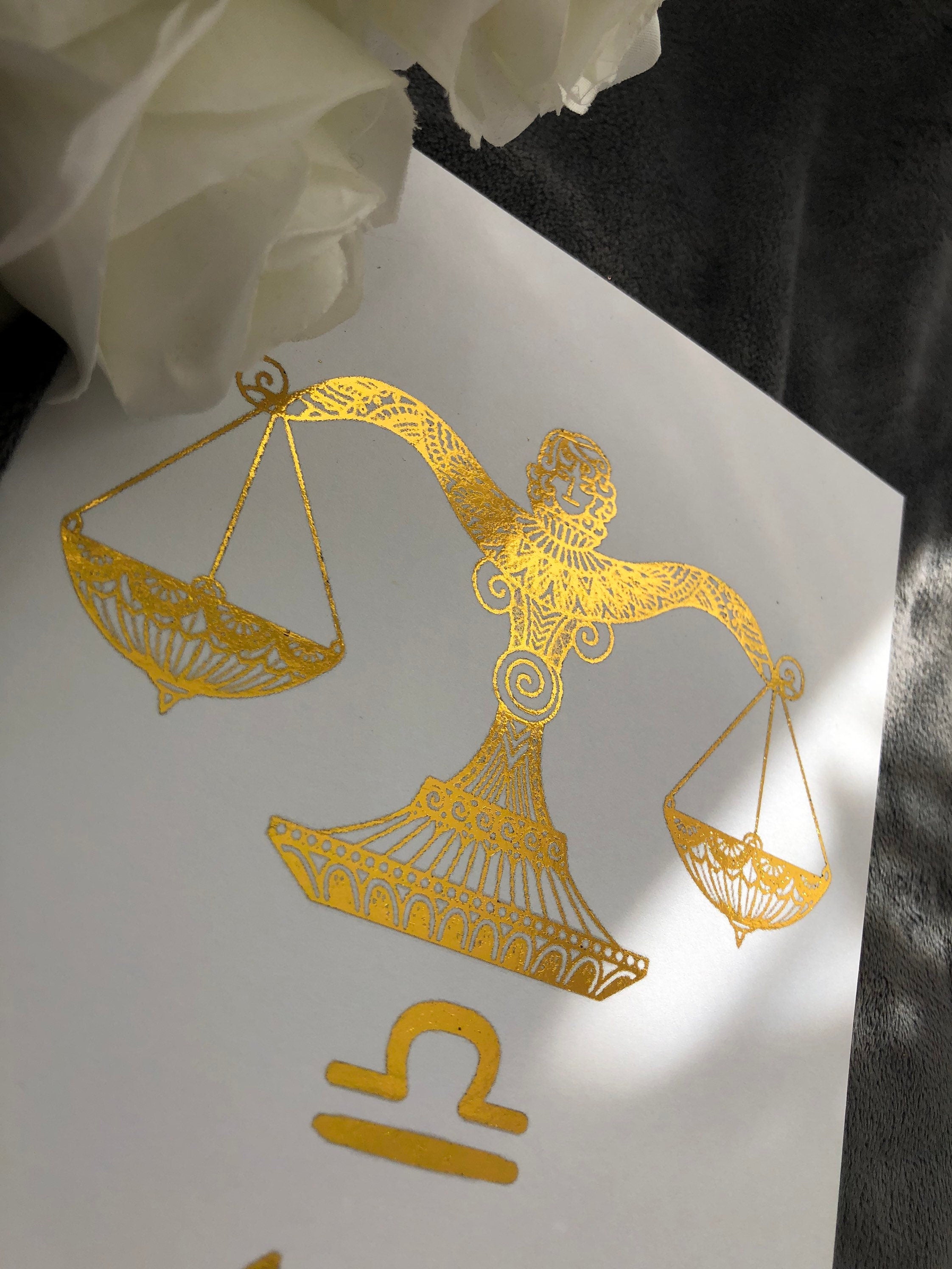 A beautiful Libra Star Sign Foil Print featuring elegant scales design, symbolizing balance and harmony, perfect for home decor.