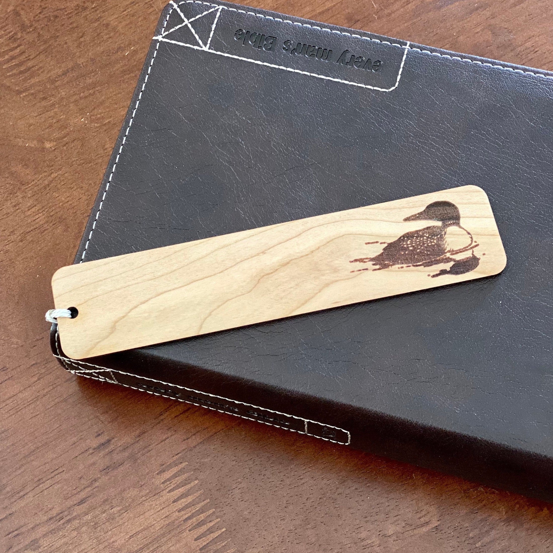 Loon Engraved Wood Bookmark made of Cherry hardwood with a tassel, featuring a detailed loon illustration.