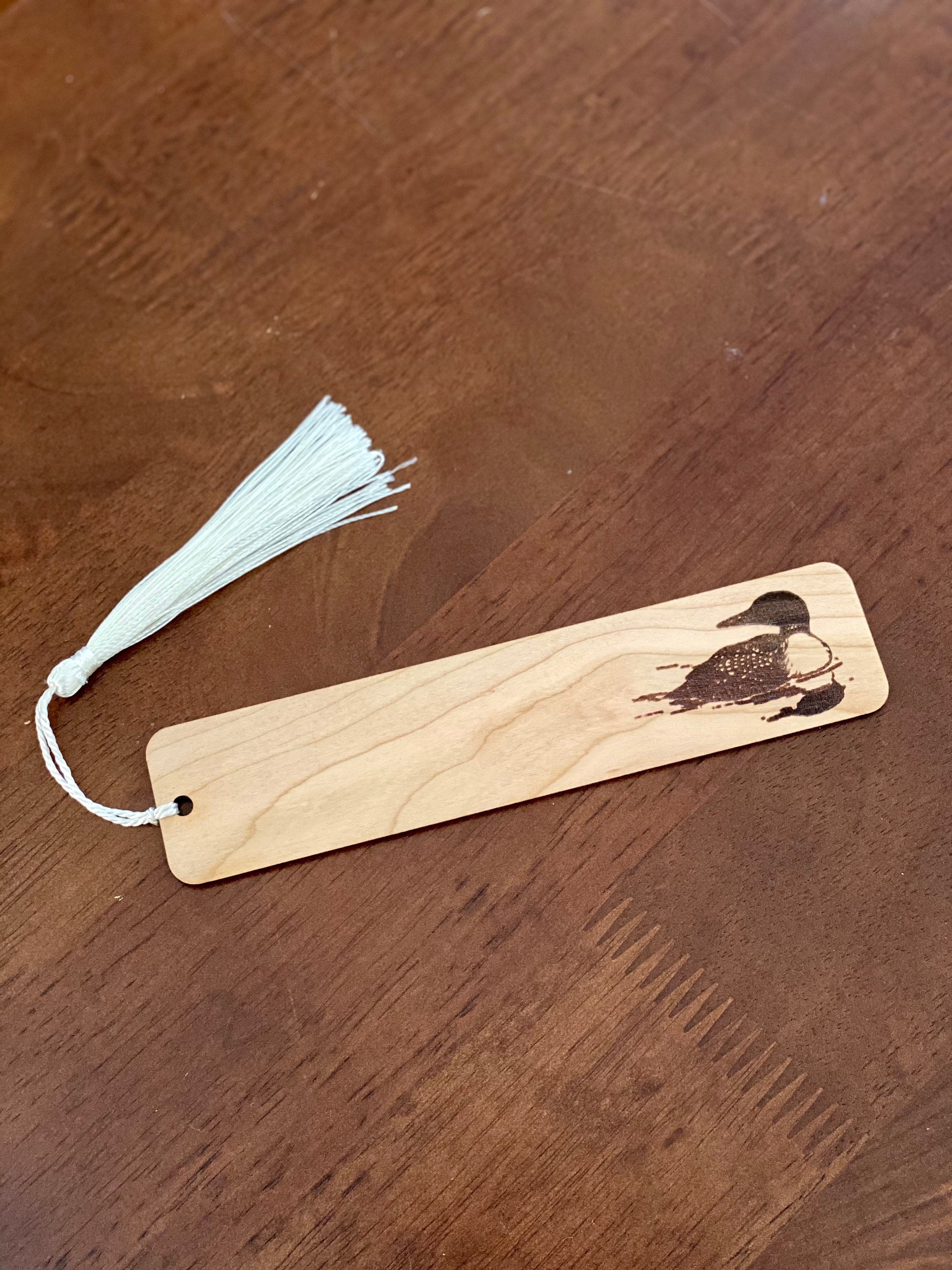 Loon Engraved Wood Bookmark made of Cherry hardwood with a tassel, featuring a detailed loon illustration.