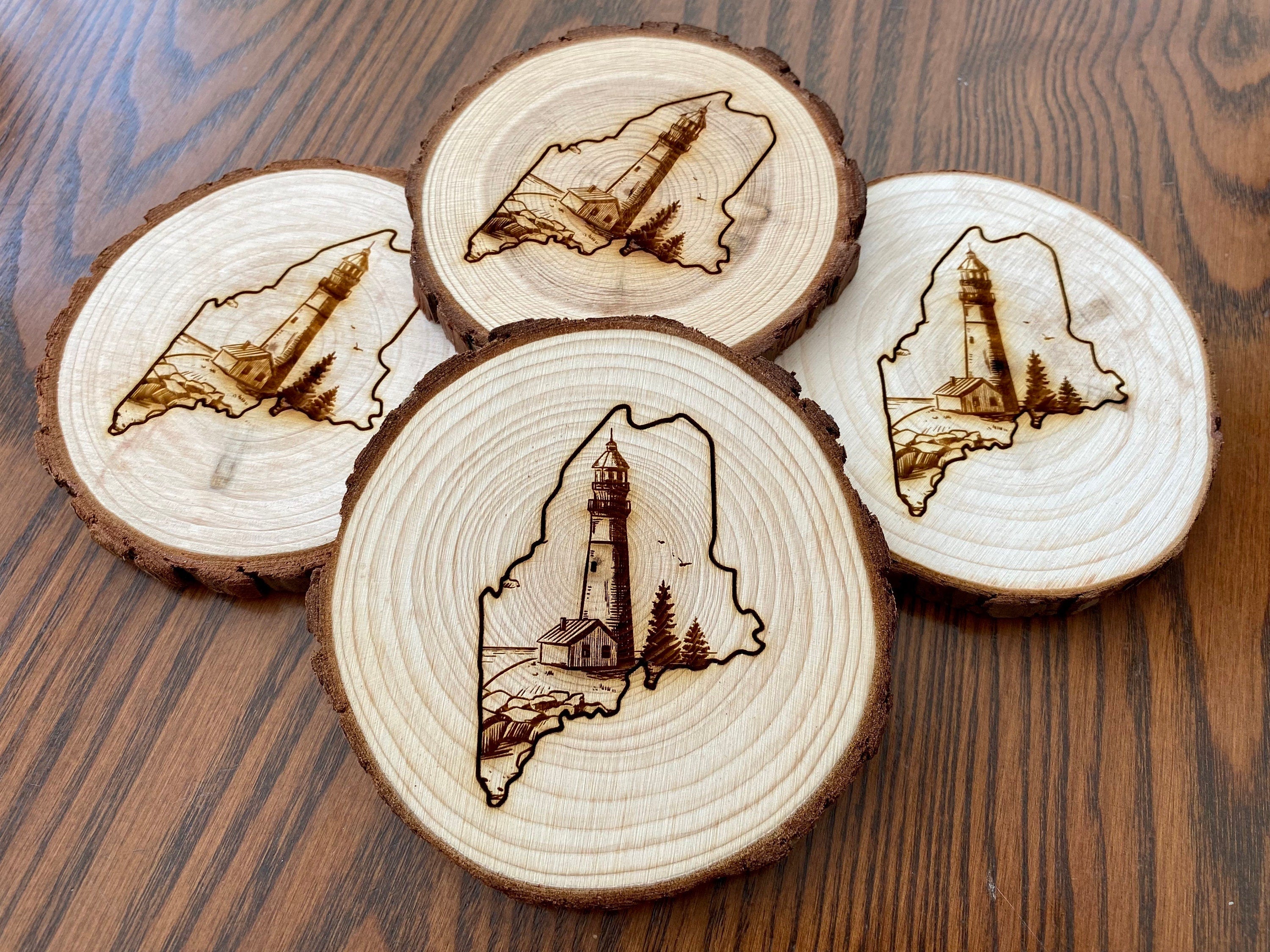 Maine Lighthouse Engraved Wood Coaster Set featuring state outline and coastal scene.