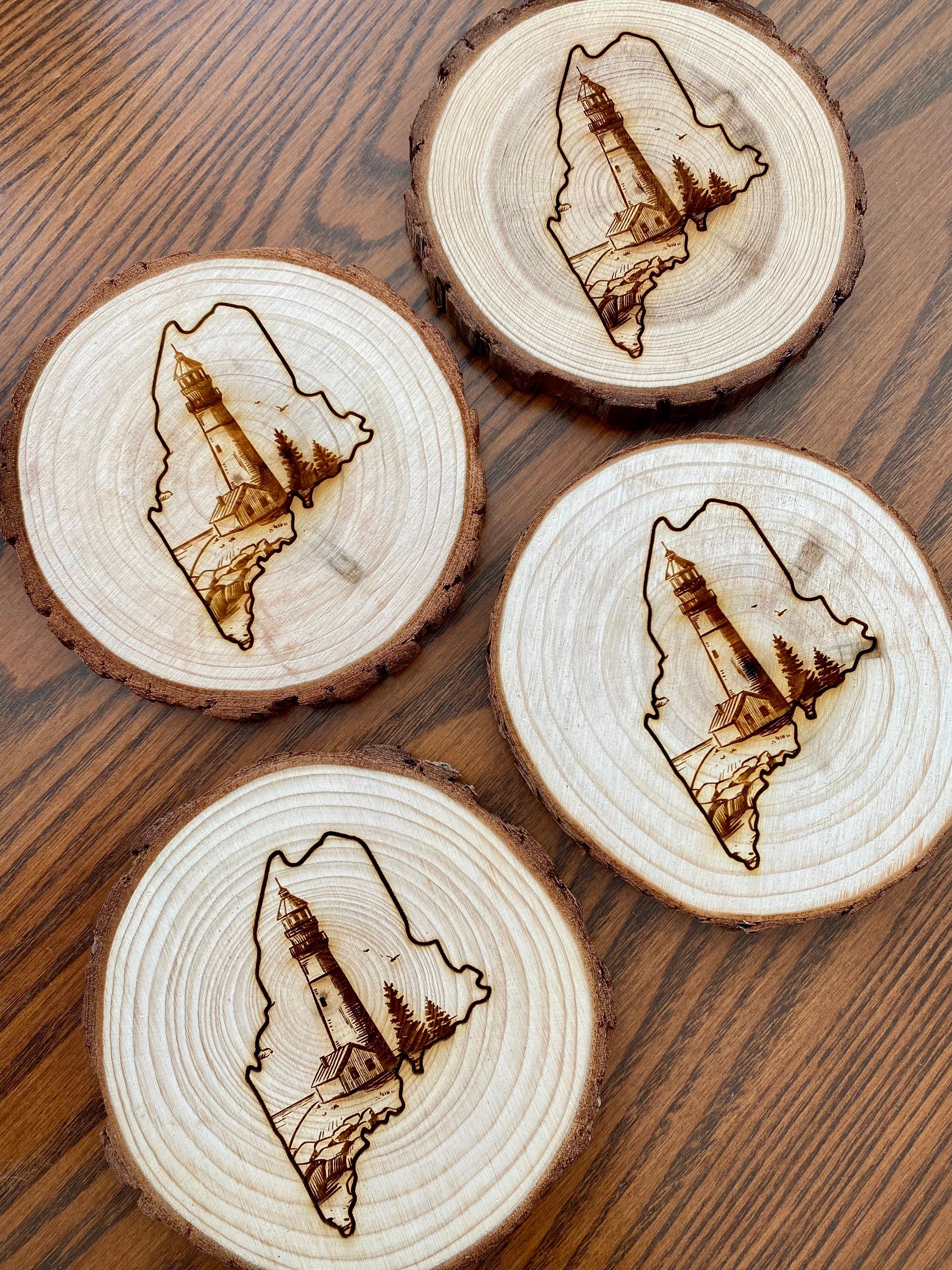 Maine Lighthouse Engraved Wood Coaster Set featuring state outline and coastal scene.