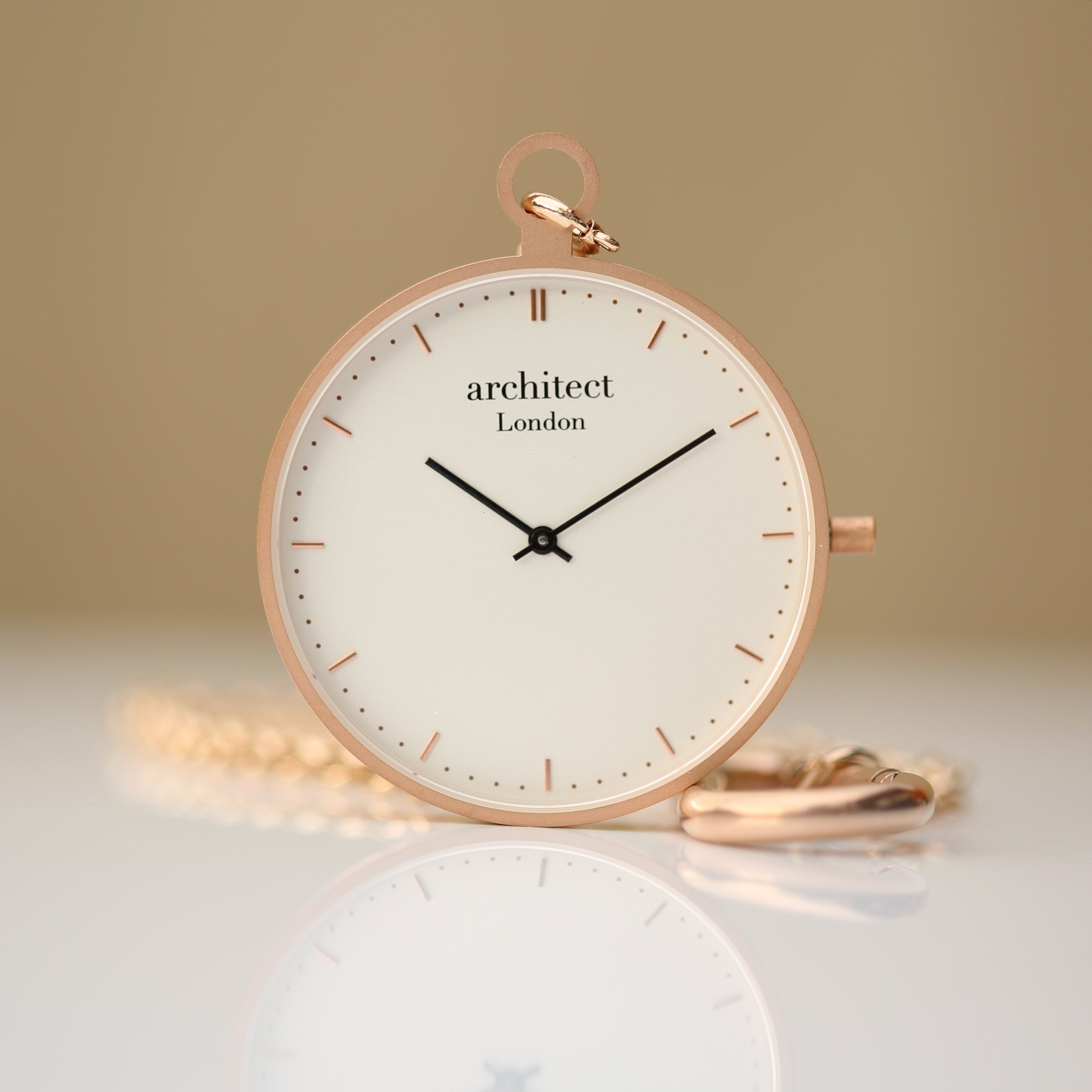 Modern Pocket Watch in rose gold with sapphire glass and engravable back, showcasing a sleek design and luxurious finish.