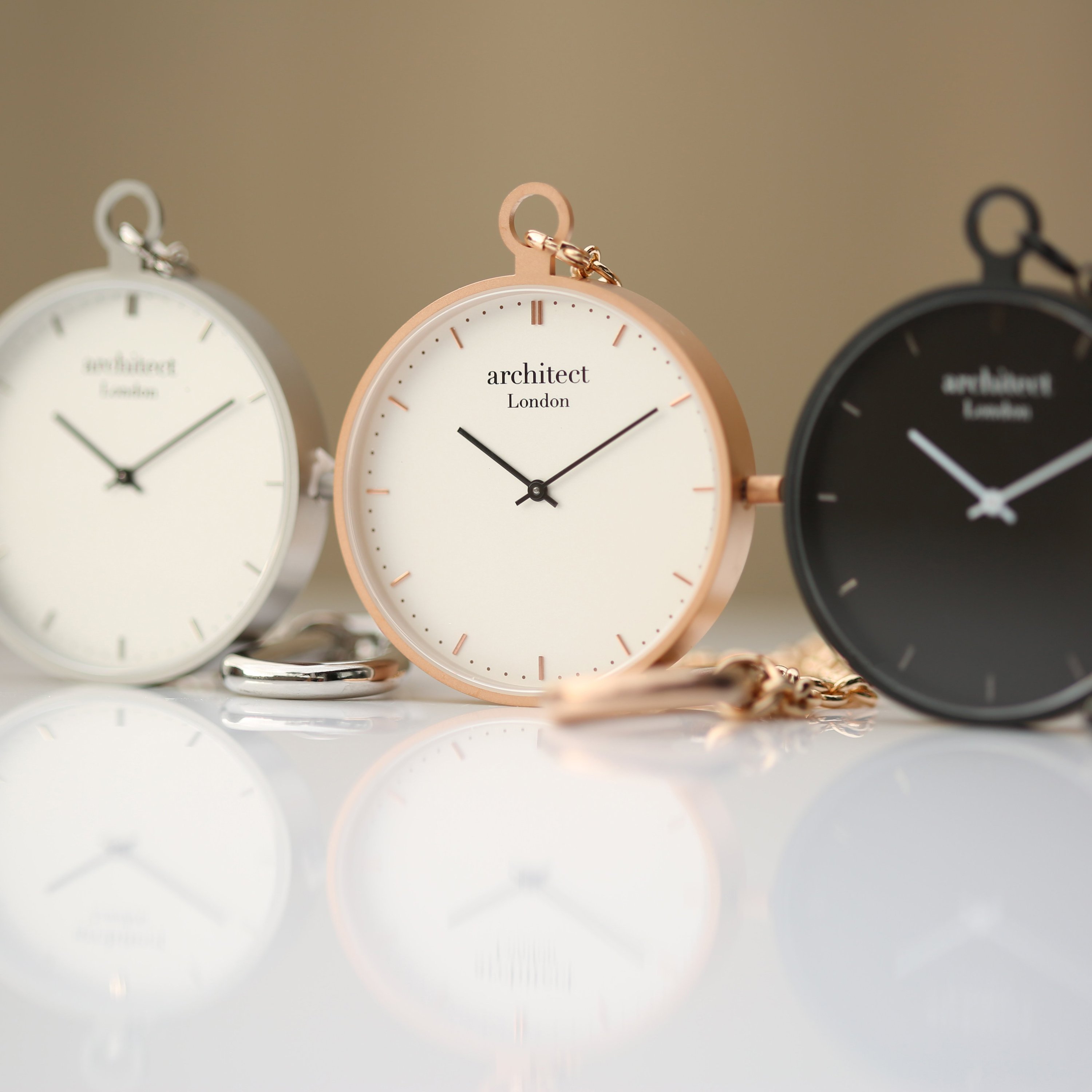 Modern Pocket Watch in rose gold with sapphire glass and engravable back, showcasing a sleek design and luxurious finish.