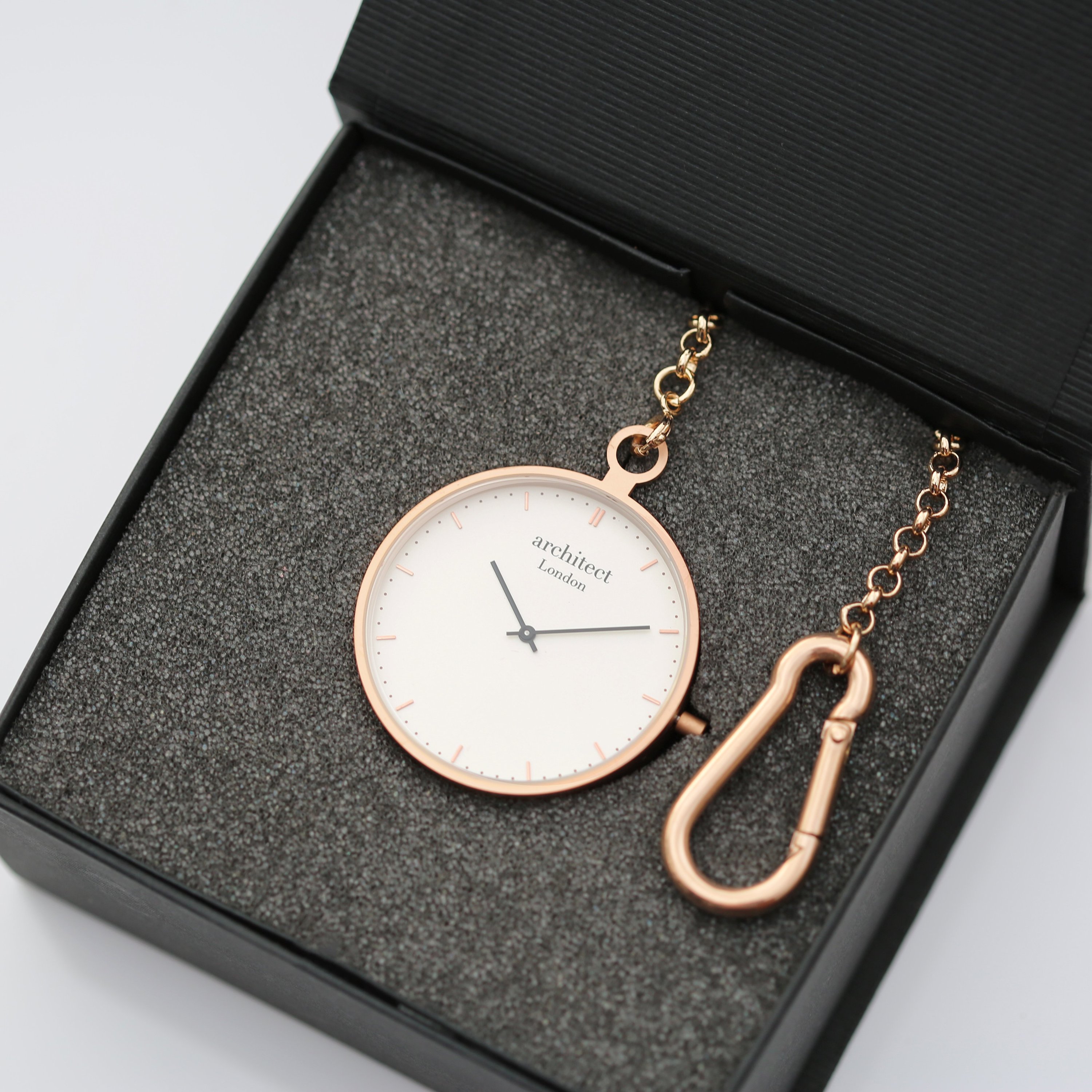 Modern Pocket Watch in rose gold with sapphire glass and engravable back, showcasing a sleek design and luxurious finish.