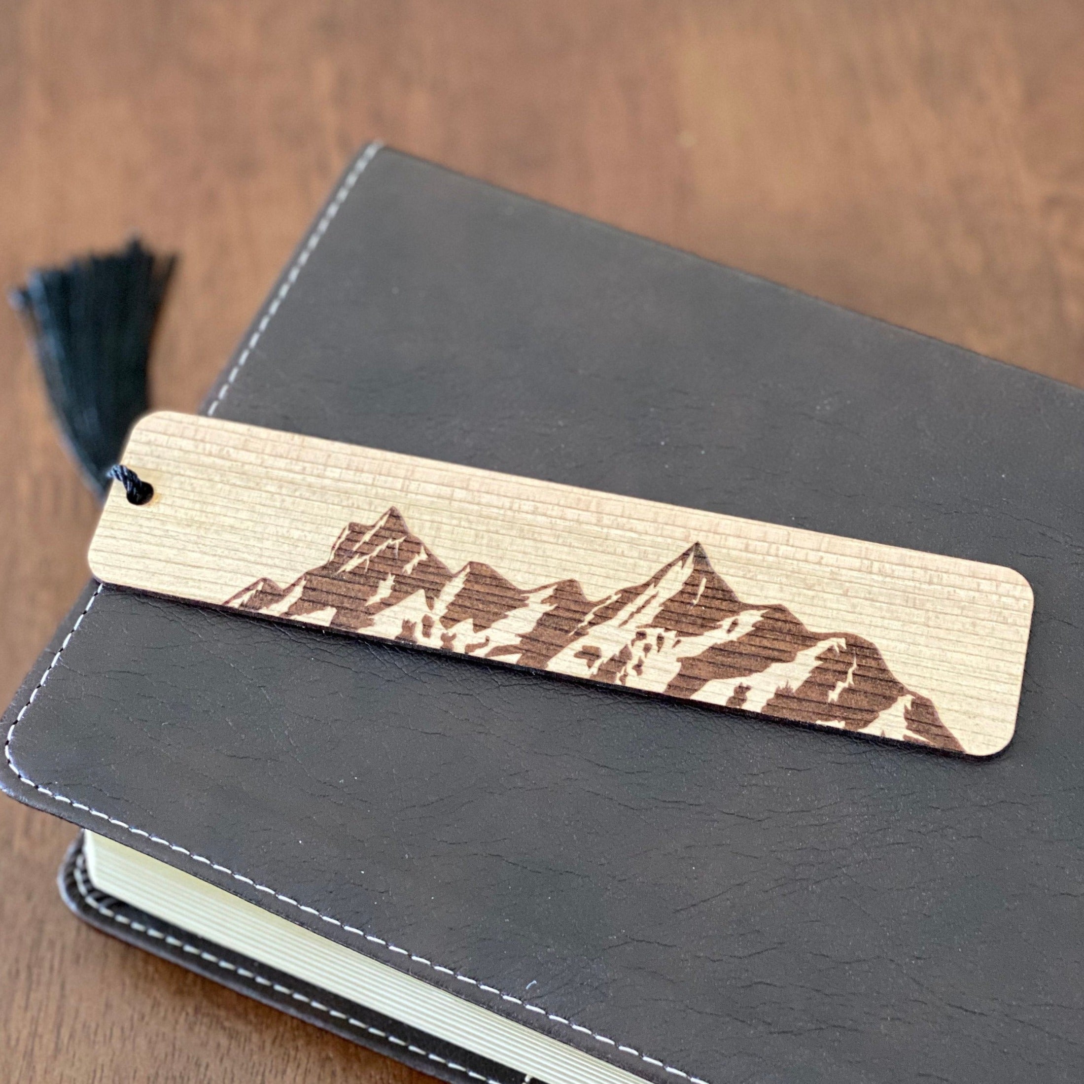 Mountain Engraved Wood Bookmark made of Cherry hardwood with a mountain range design and colorful tassel.