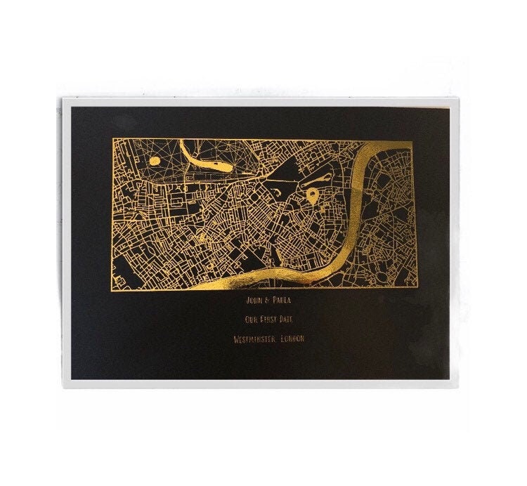 A beautifully designed foil printed map highlighting a couple's first date location, featuring elegant foil accents in various colors.