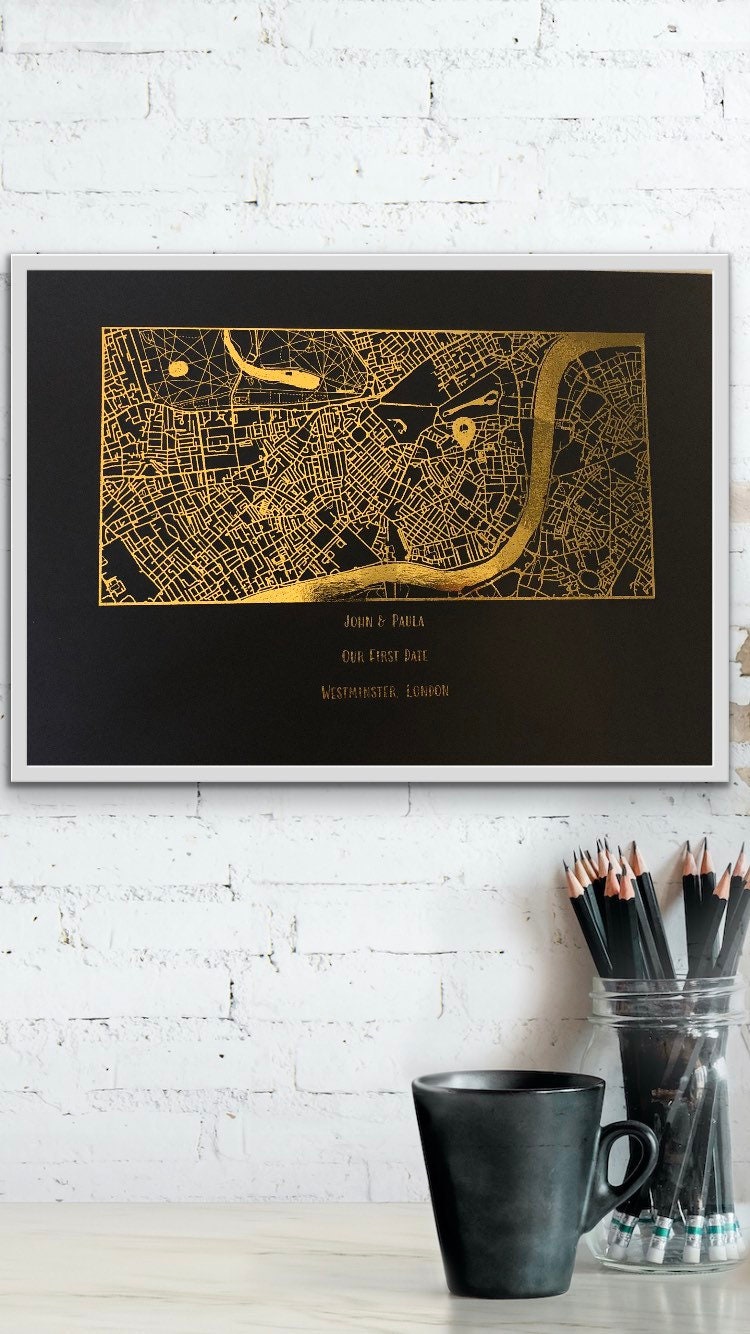 A beautifully designed foil printed map highlighting a couple's first date location, featuring elegant foil accents in various colors.