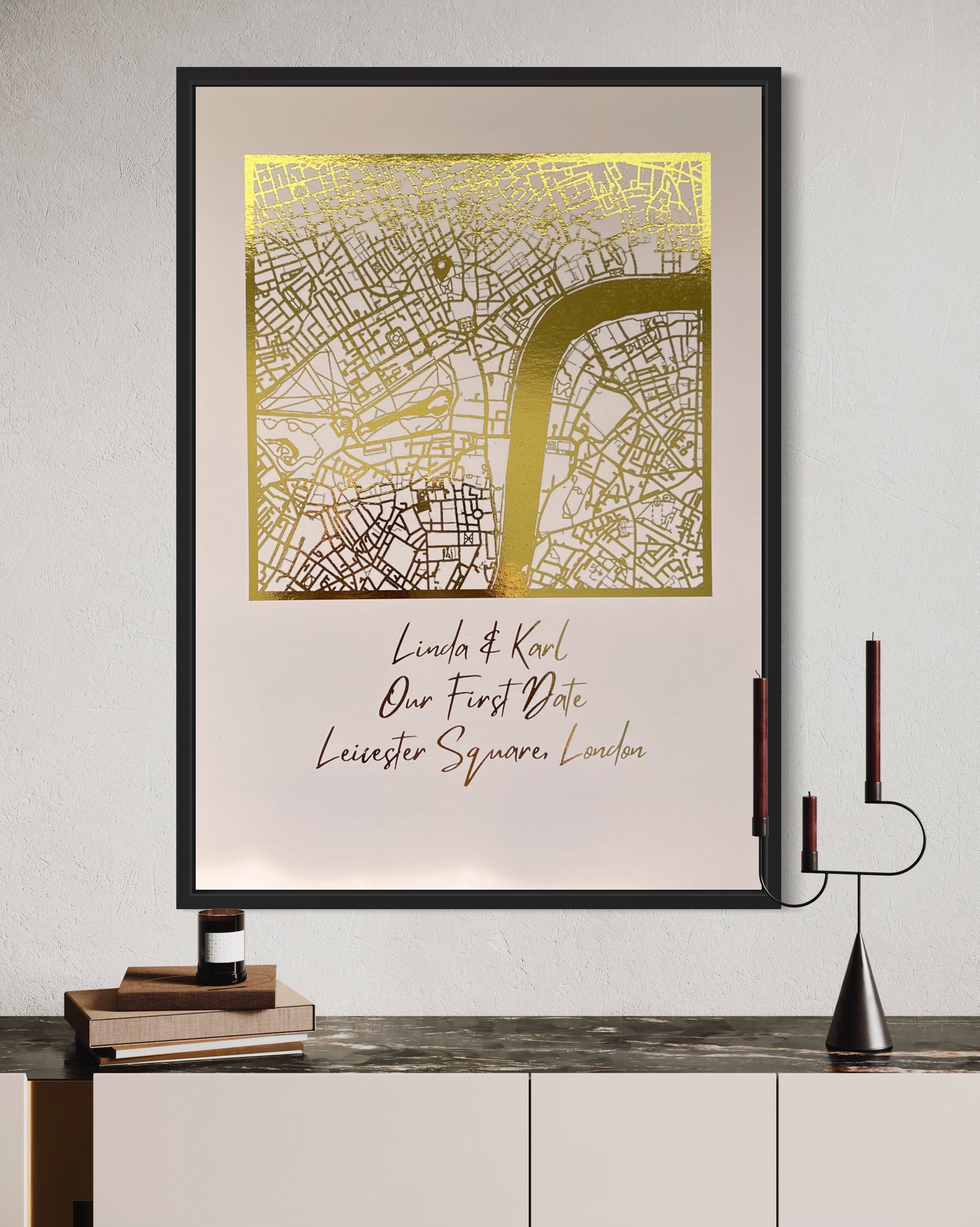 A beautifully crafted square map featuring gold foil accents, personalized with couple's names and first date location.