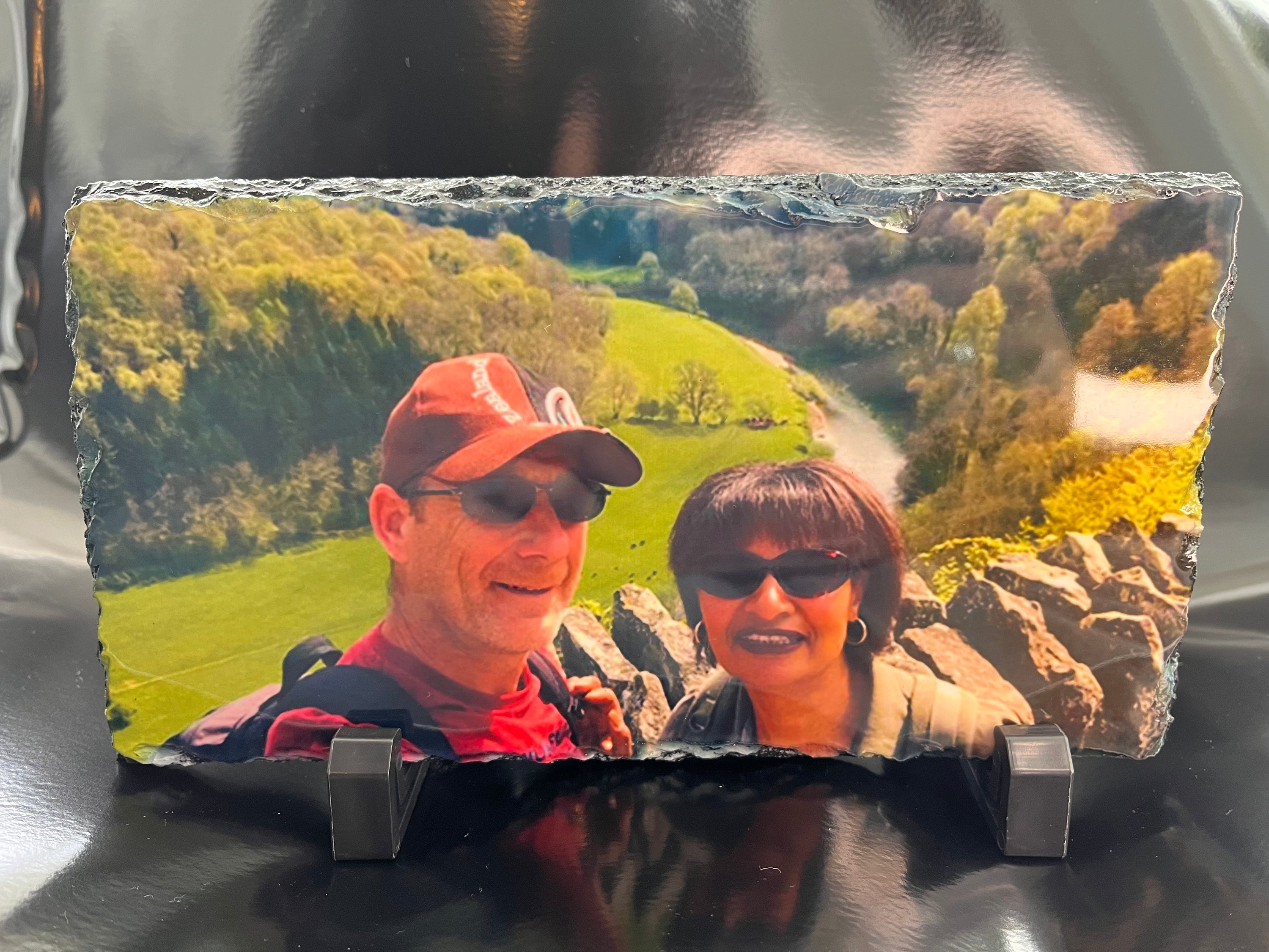 A personalised photo slate featuring a glossy image finish, showcasing a cherished memory on natural slate material.