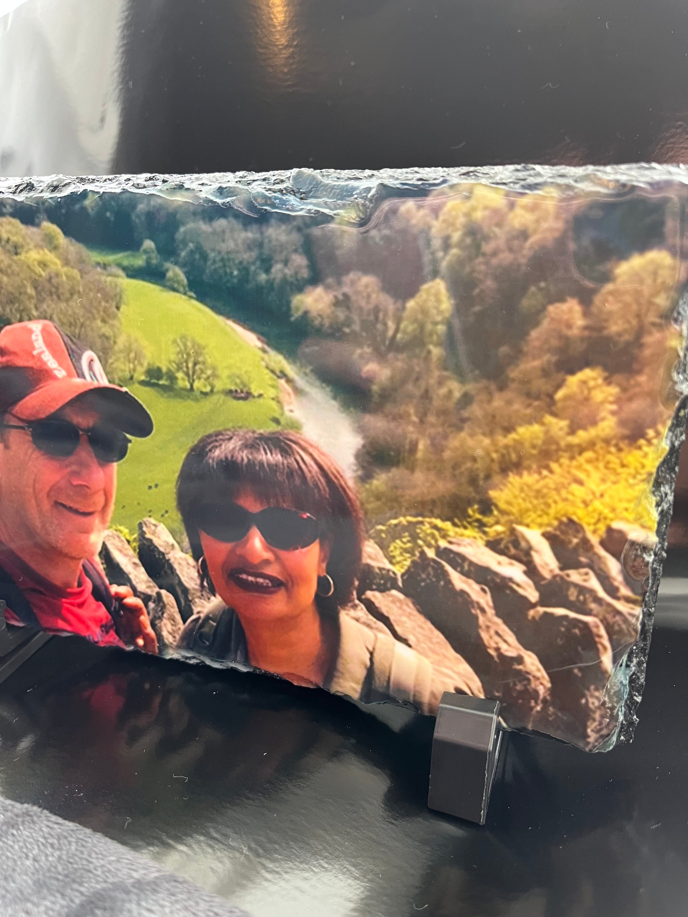 A personalised photo slate featuring a glossy image finish, showcasing a cherished memory on natural slate material.