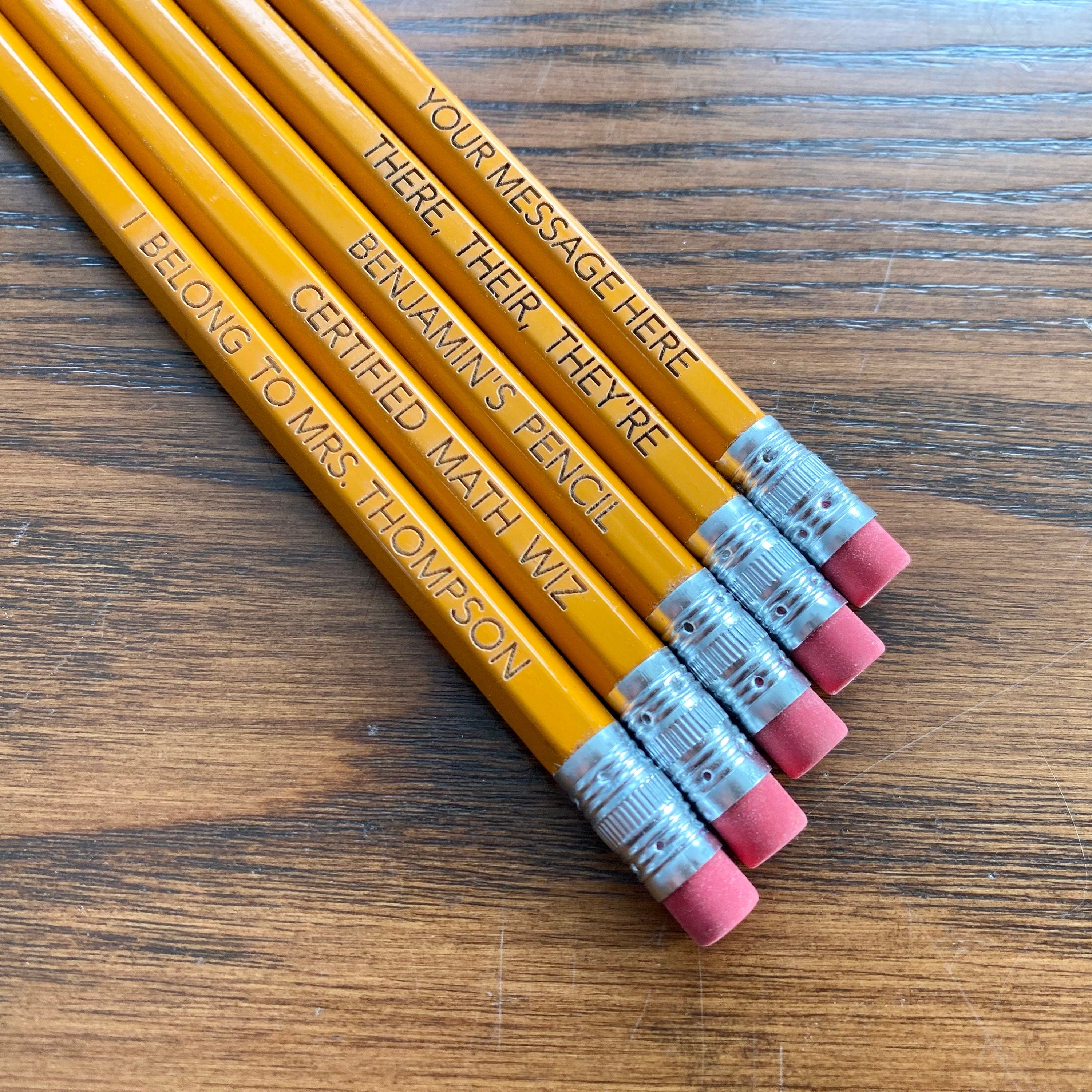 A set of personalized #2 pencils with laser engraving, showcasing custom messages and names.