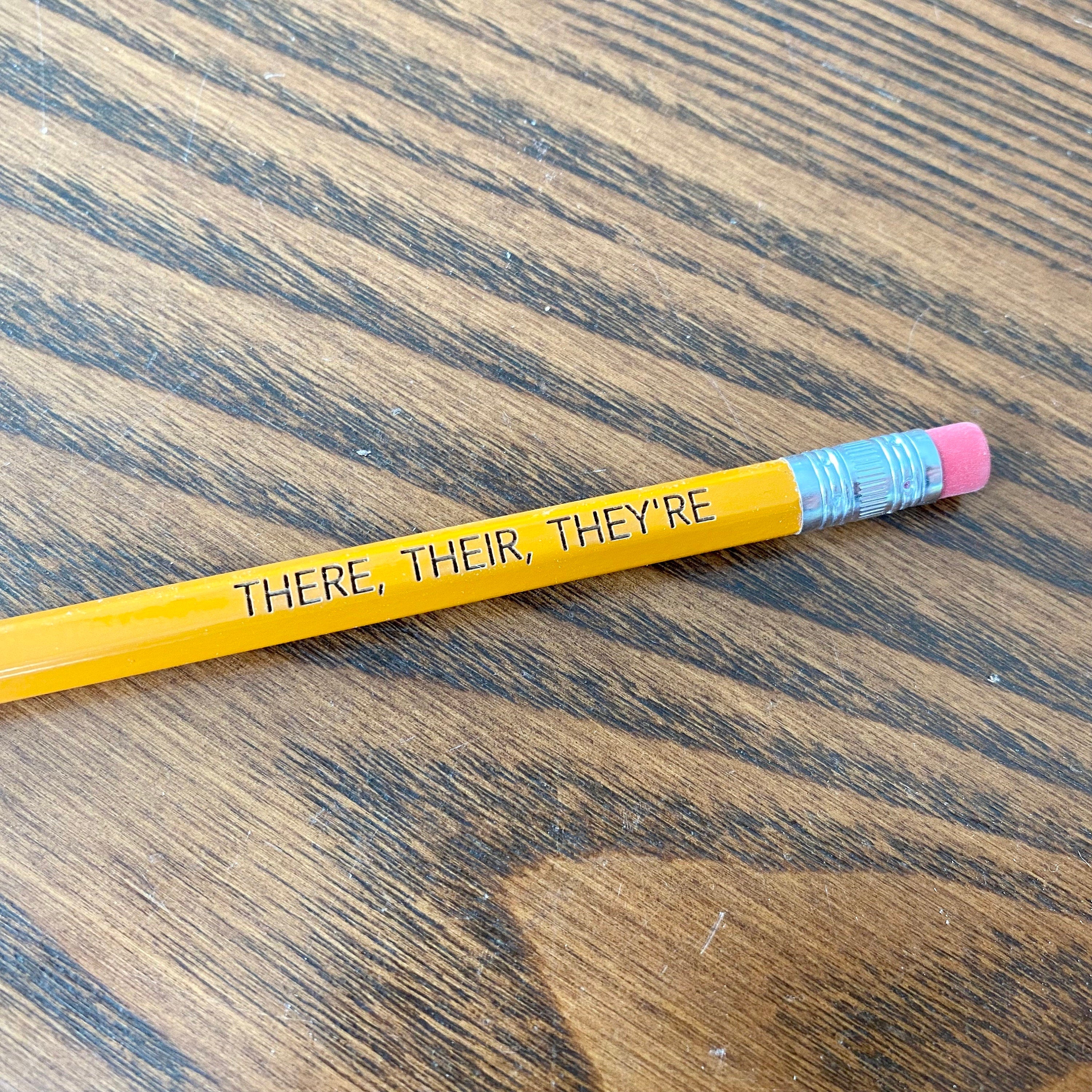 A set of personalized #2 pencils with laser engraving, showcasing custom messages and names.