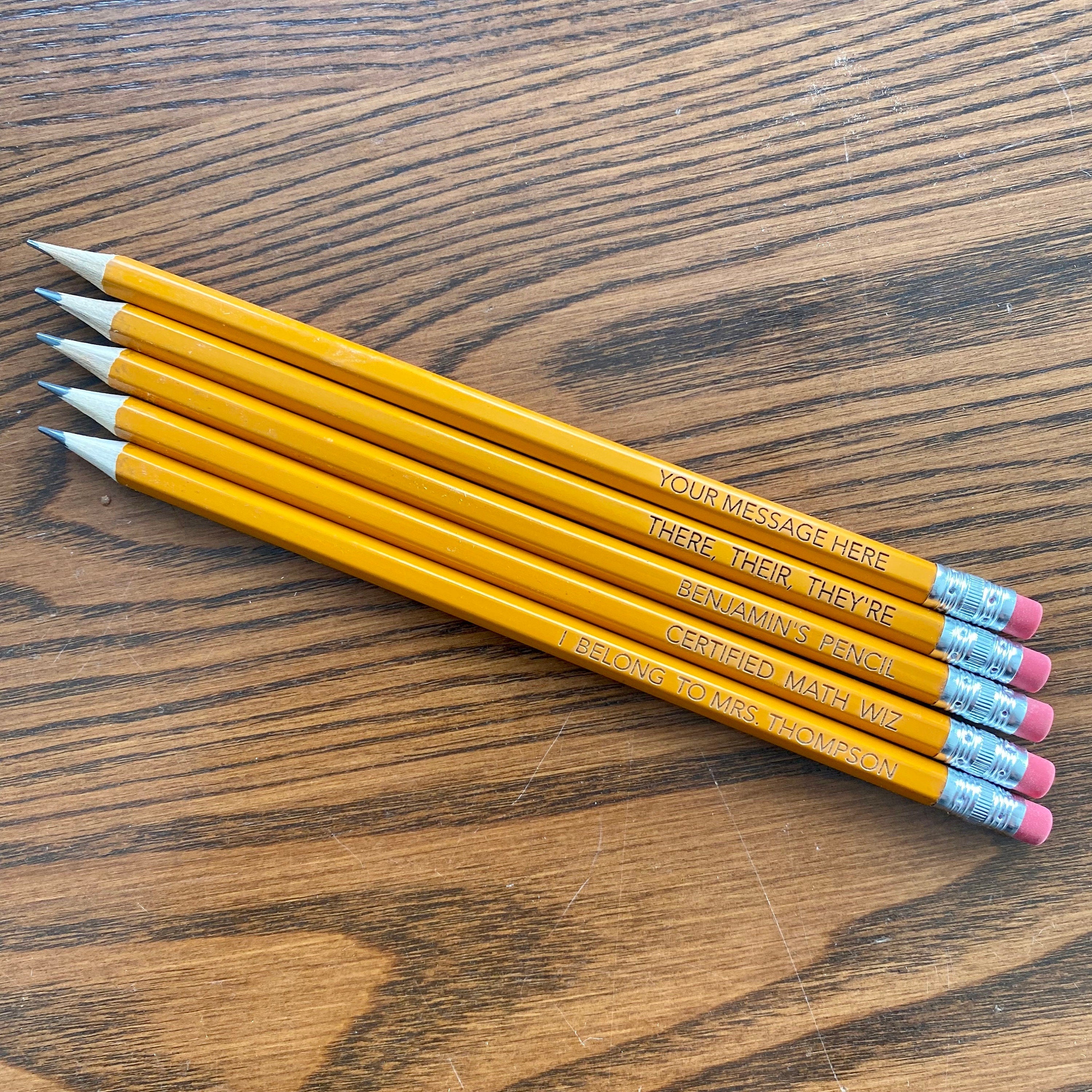 A set of personalized #2 pencils with laser engraving, showcasing custom messages and names.