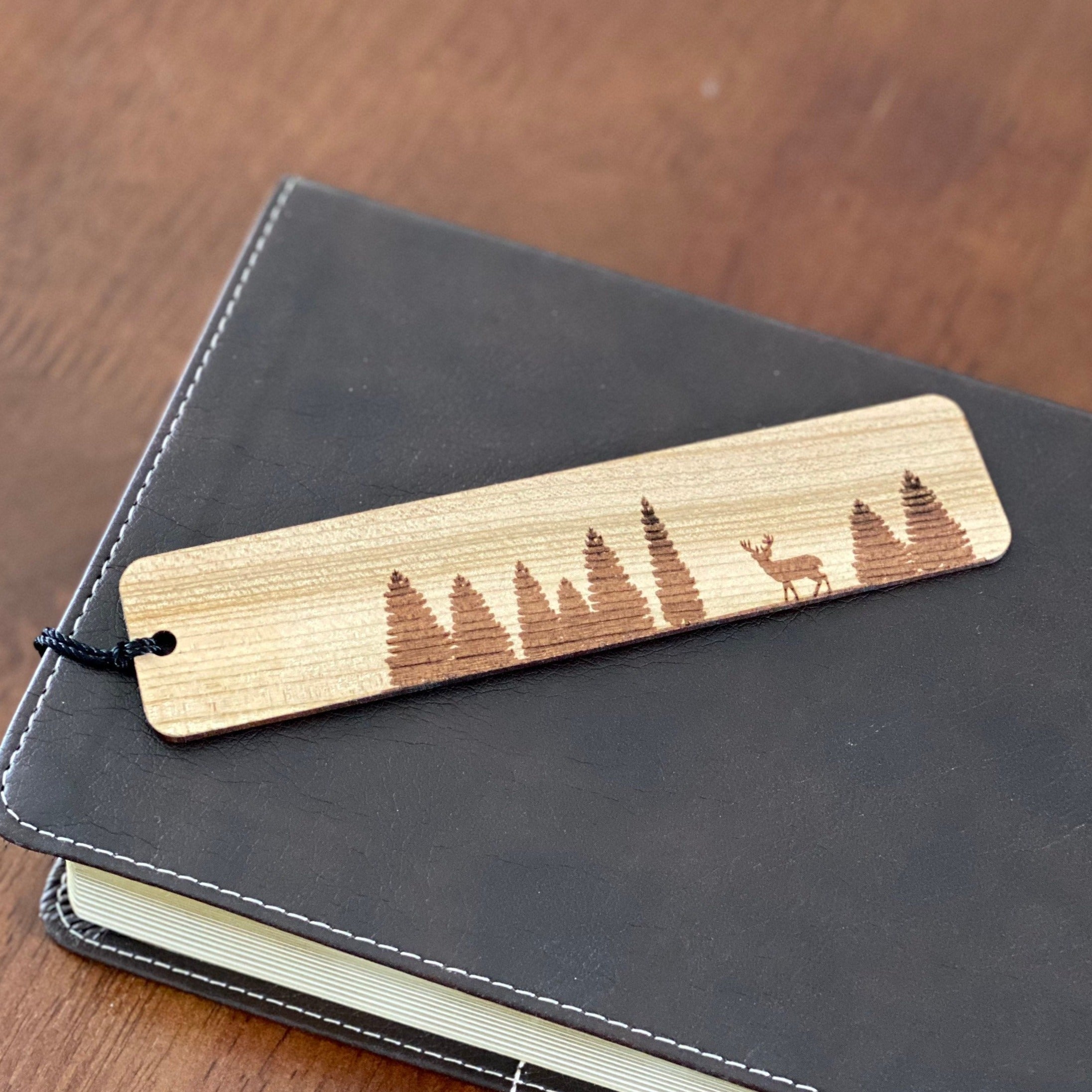 Pine Tree & Deer Engraved Wood Bookmark made from Cherry hardwood with a tassel.