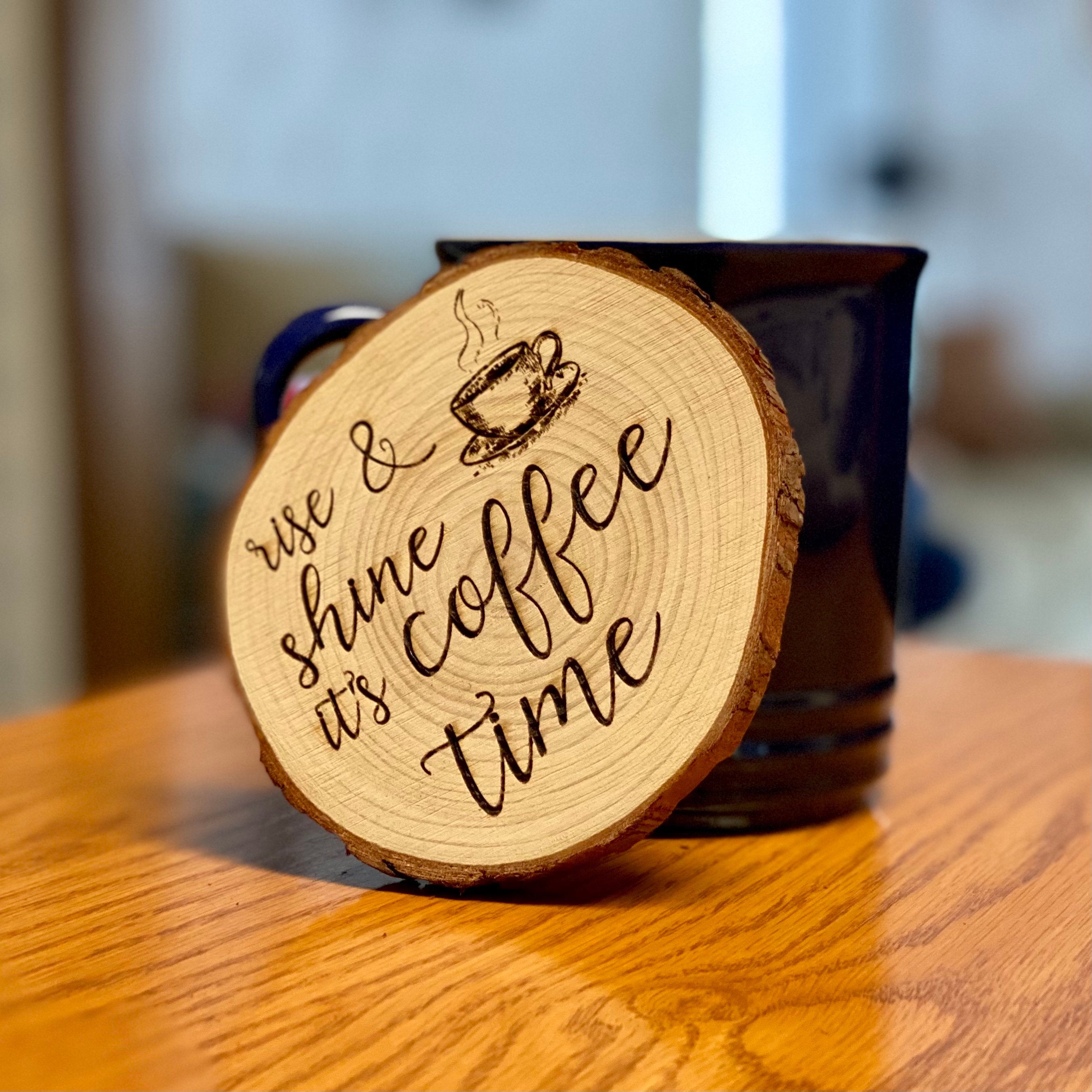 Set of four rustic engraved wood coasters made from Californian Pine, featuring intricate coffee-themed designs.