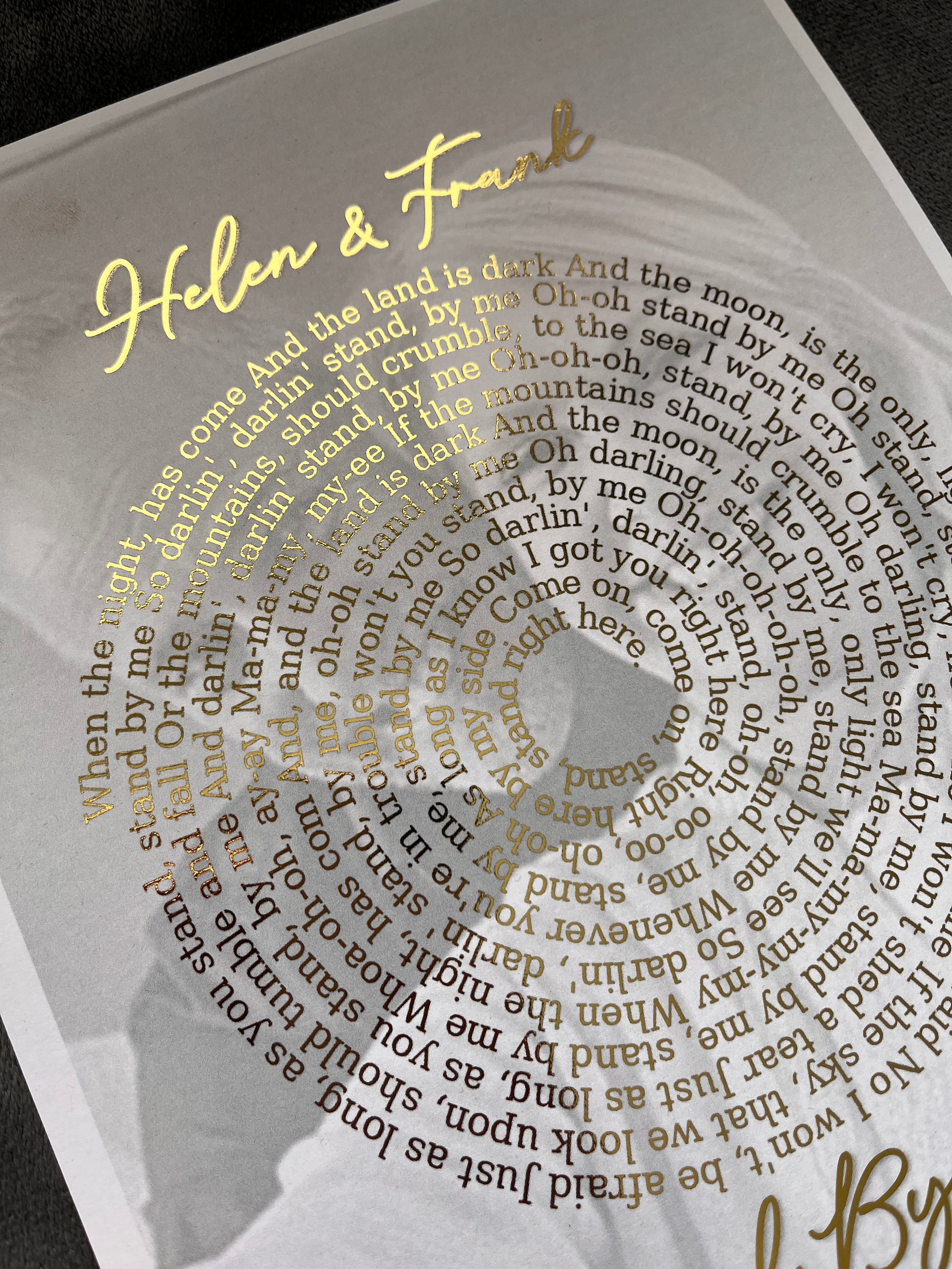 Personalized Spotify Spiral Lyrics & Image Print featuring gold foil lyrics and a background image.