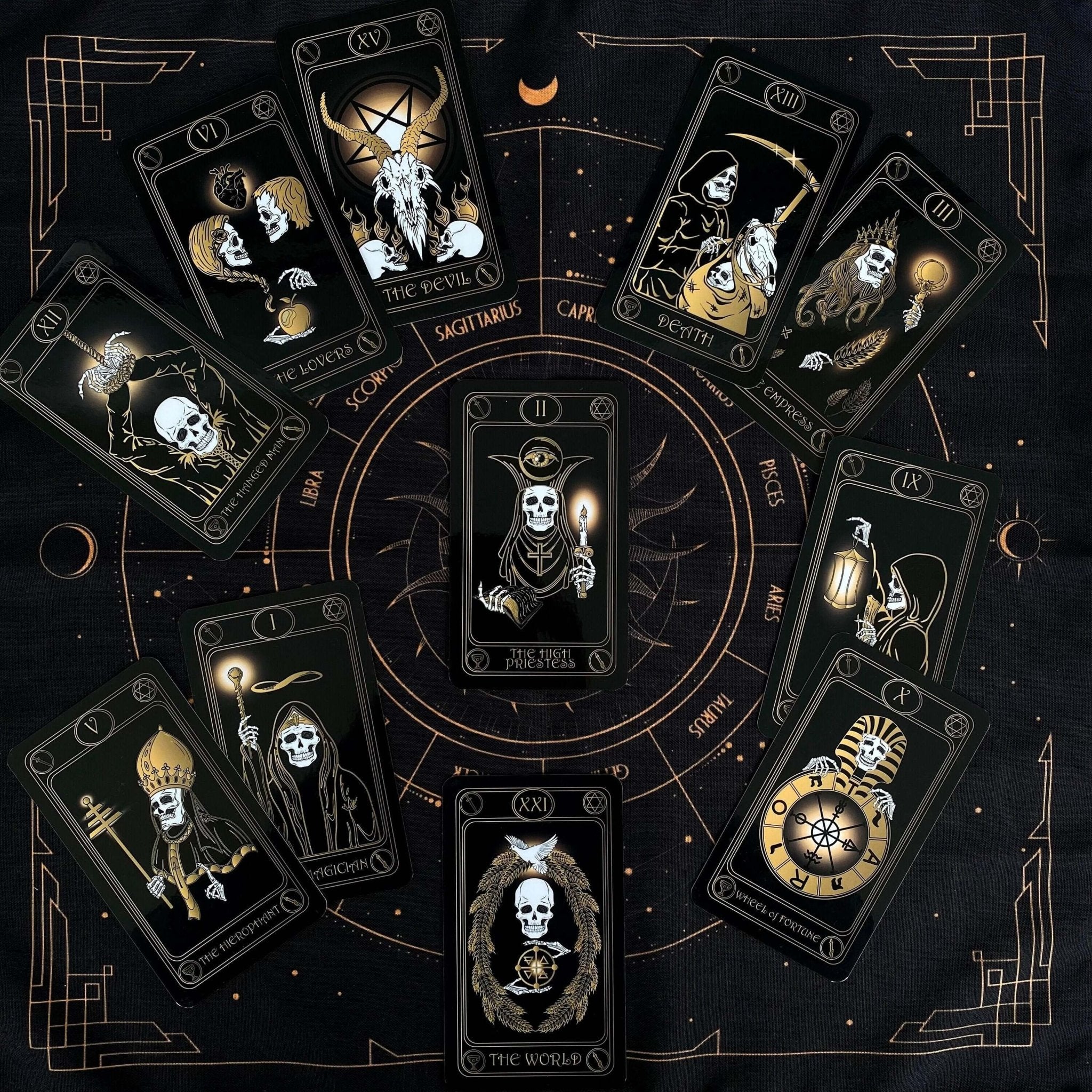 Gold Skull Tarot Deck featuring 78 cards, guidebook, velvet bag, and wooden box, elegantly designed for tarot enthusiasts.