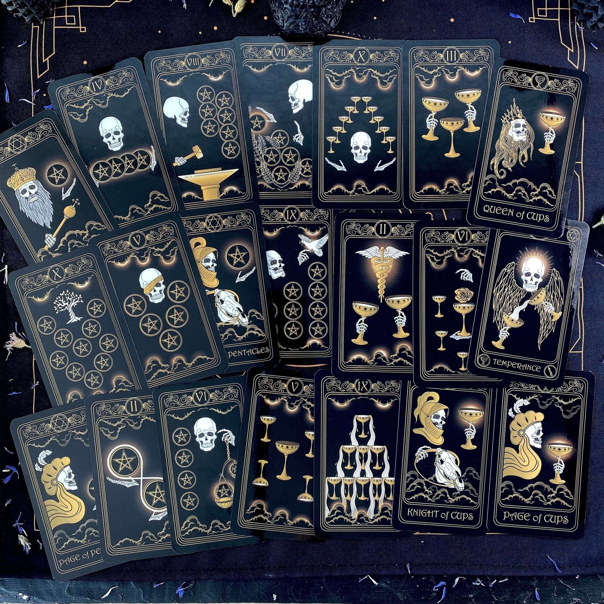 Gold Skull Tarot Deck featuring 78 cards, guidebook, velvet bag, and wooden box, elegantly designed for tarot enthusiasts.