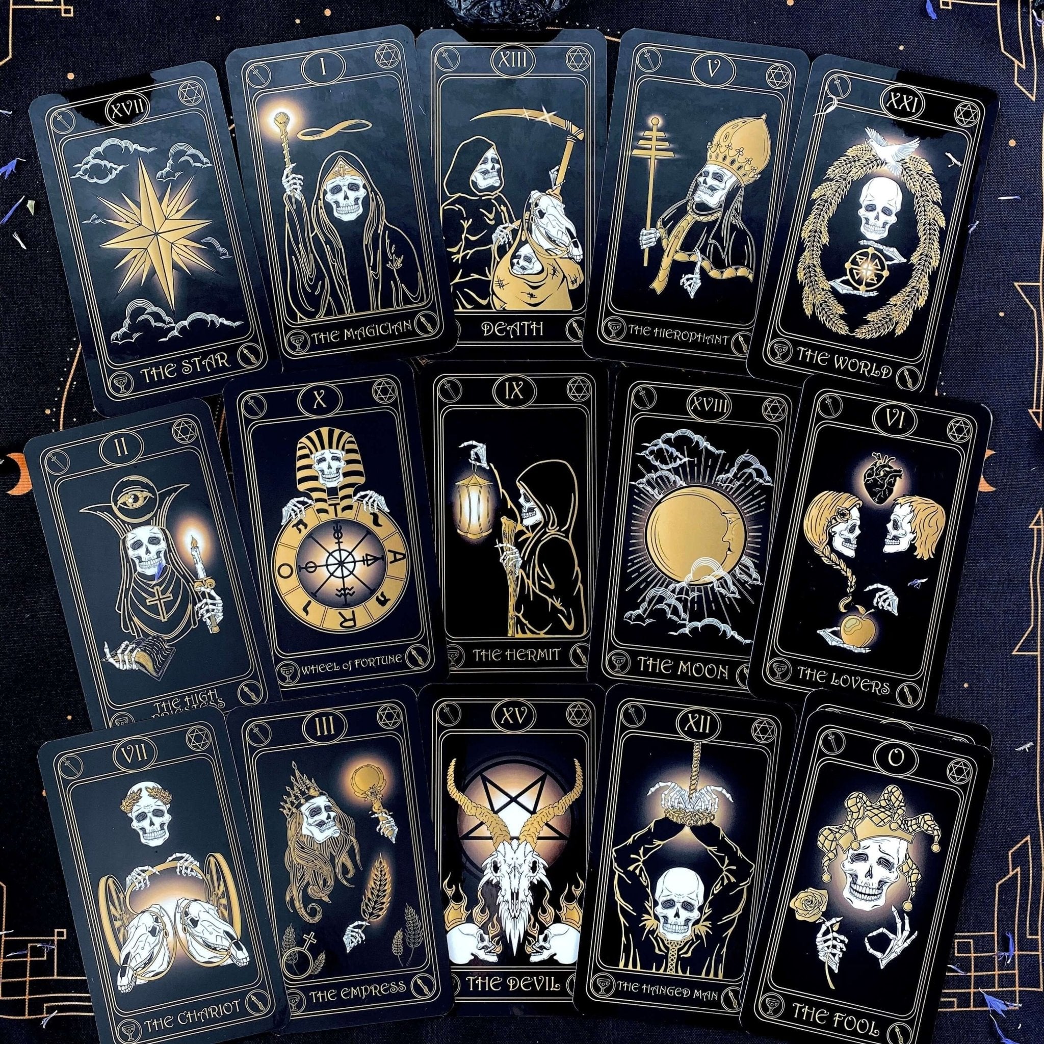 Gold Skull Tarot Deck featuring 78 cards, guidebook, velvet bag, and wooden box, elegantly designed for tarot enthusiasts.