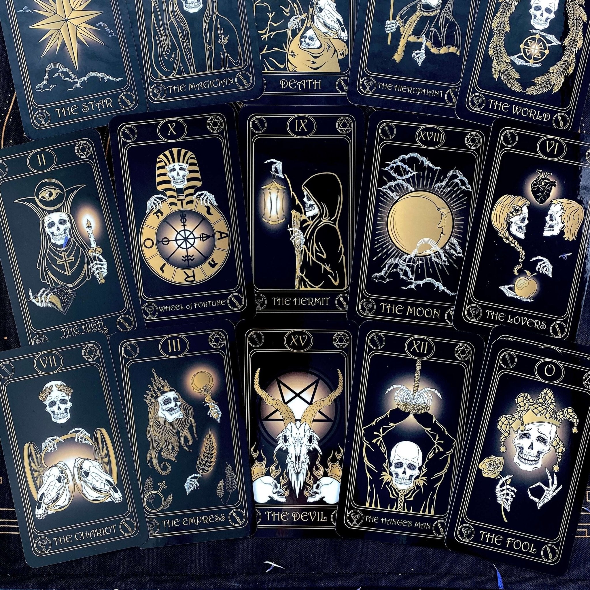 Gold Skull Tarot Deck featuring 78 cards, guidebook, velvet bag, and wooden box, elegantly designed for tarot enthusiasts.