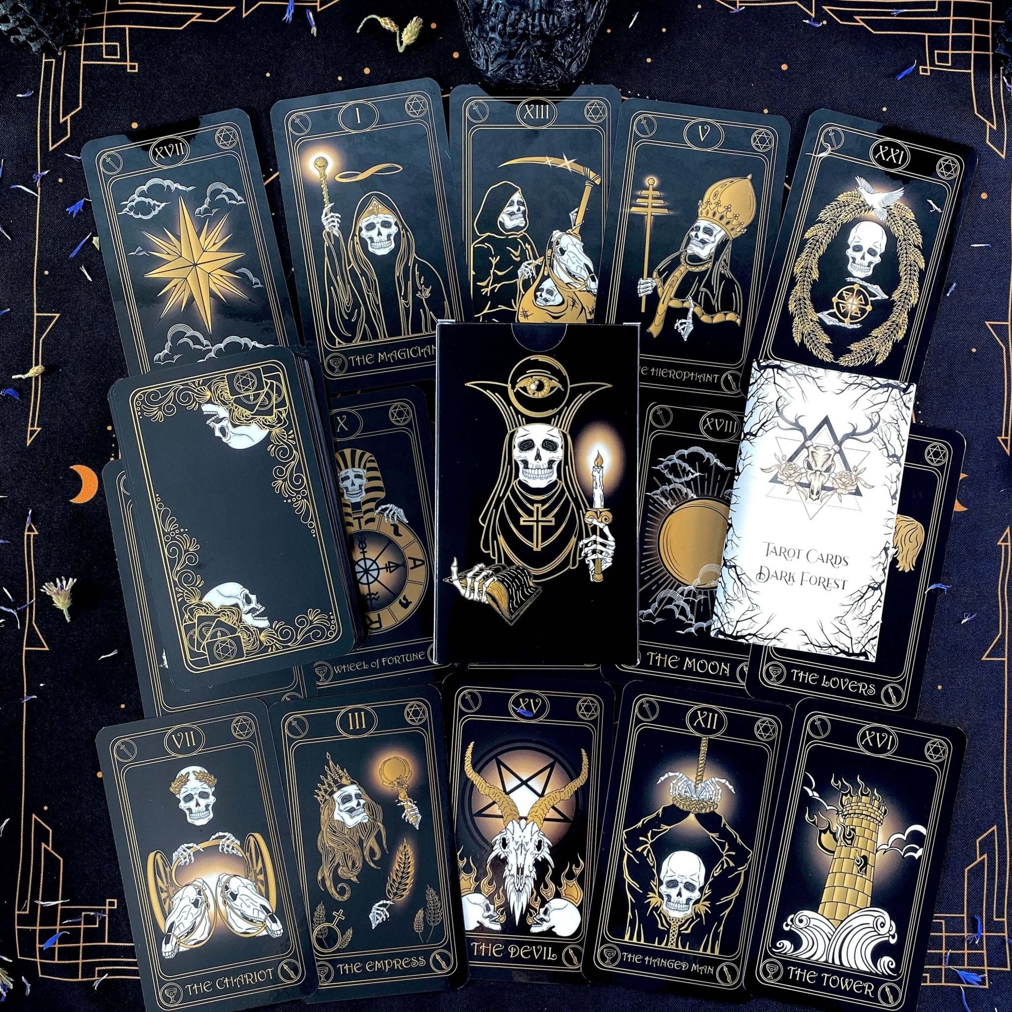 Gold Skull Tarot Deck featuring 78 cards, guidebook, velvet bag, and wooden box, elegantly designed for tarot enthusiasts.