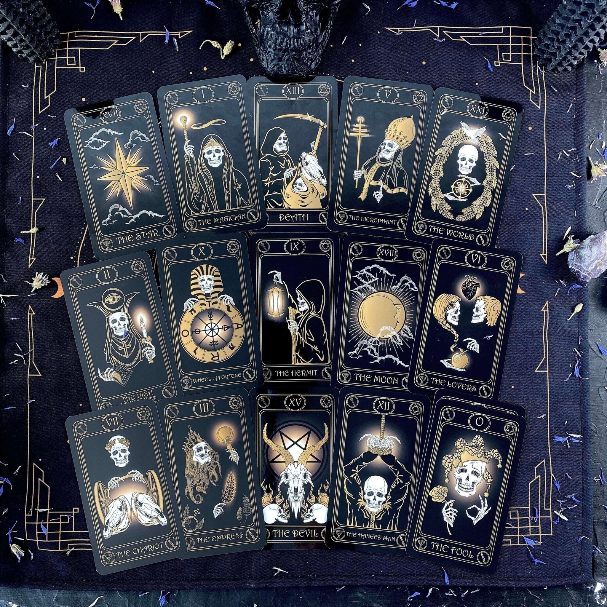 Gold Skull Tarot Deck featuring 78 cards, guidebook, velvet bag, and wooden box, elegantly designed for tarot enthusiasts.