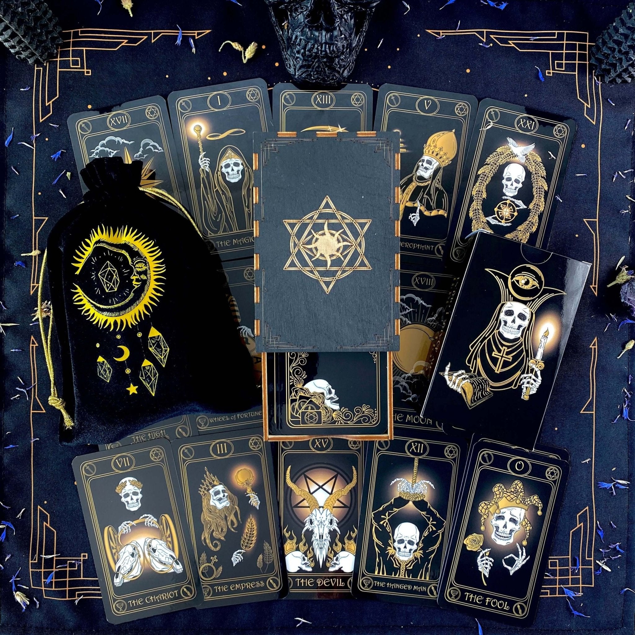 Gold Skull Tarot Deck featuring 78 cards, guidebook, velvet bag, and wooden box, elegantly designed for tarot enthusiasts.