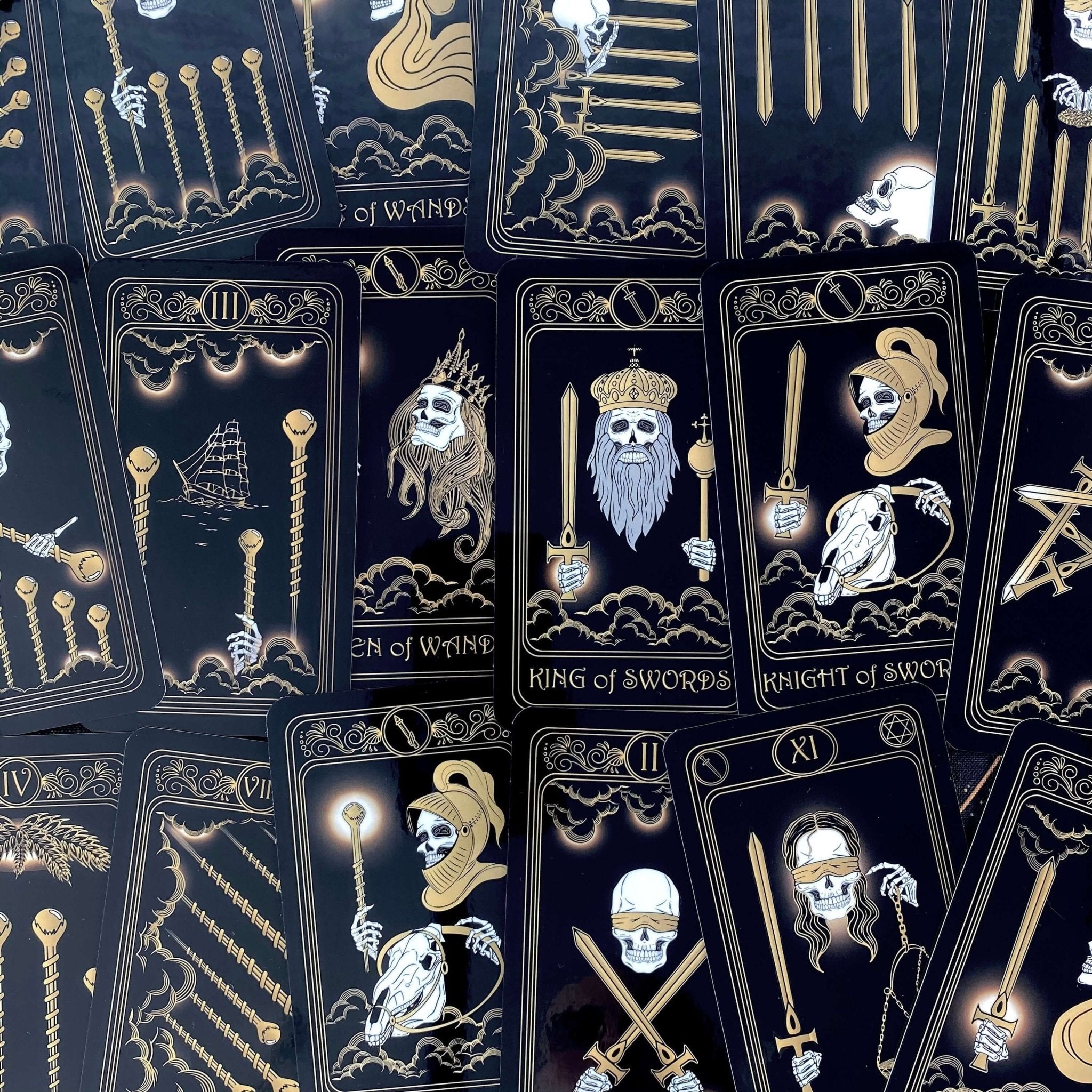 Gold Skull Tarot Deck featuring 78 cards, guidebook, velvet bag, and wooden box, elegantly designed for tarot enthusiasts.