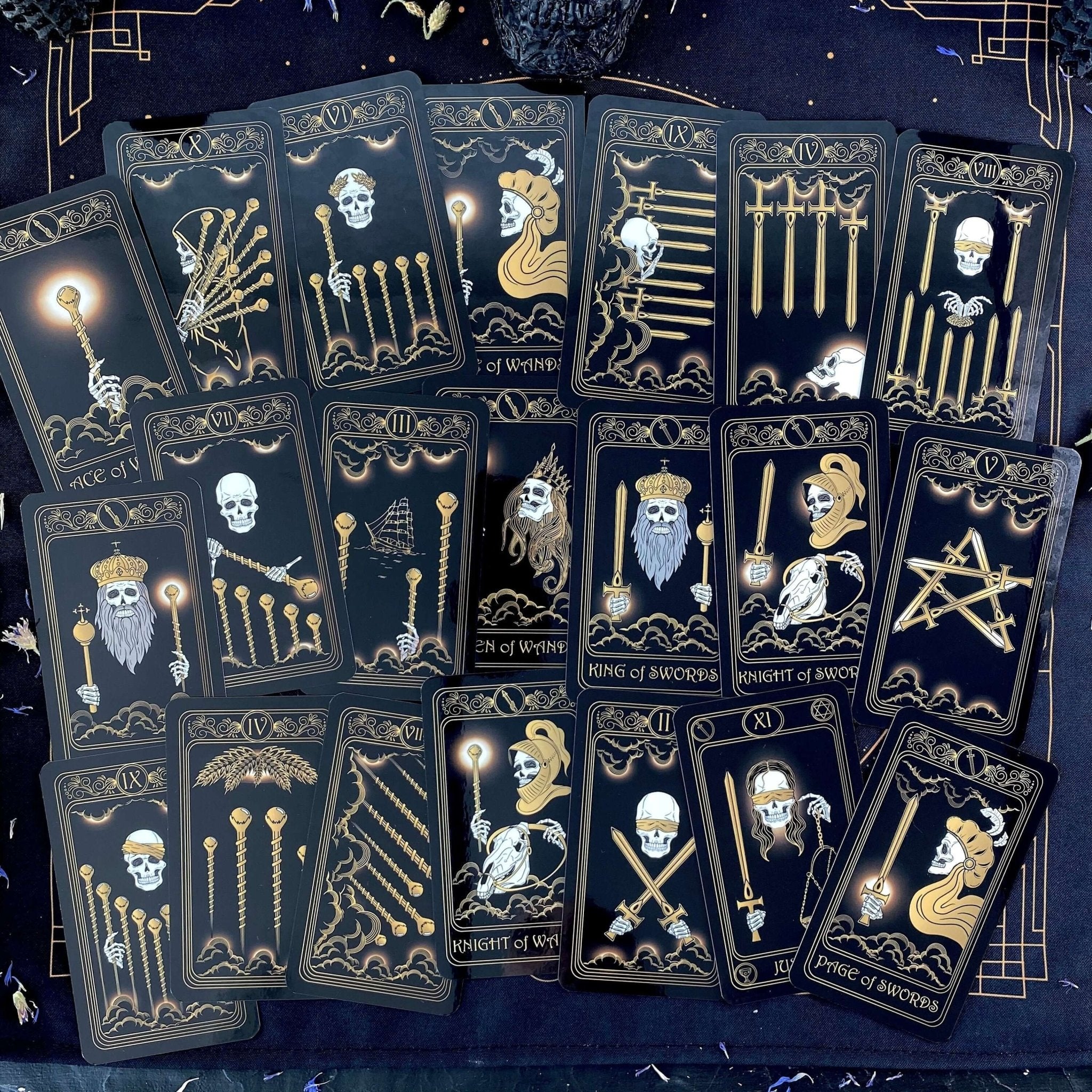 Gold Skull Tarot Deck featuring 78 cards, guidebook, velvet bag, and wooden box, elegantly designed for tarot enthusiasts.