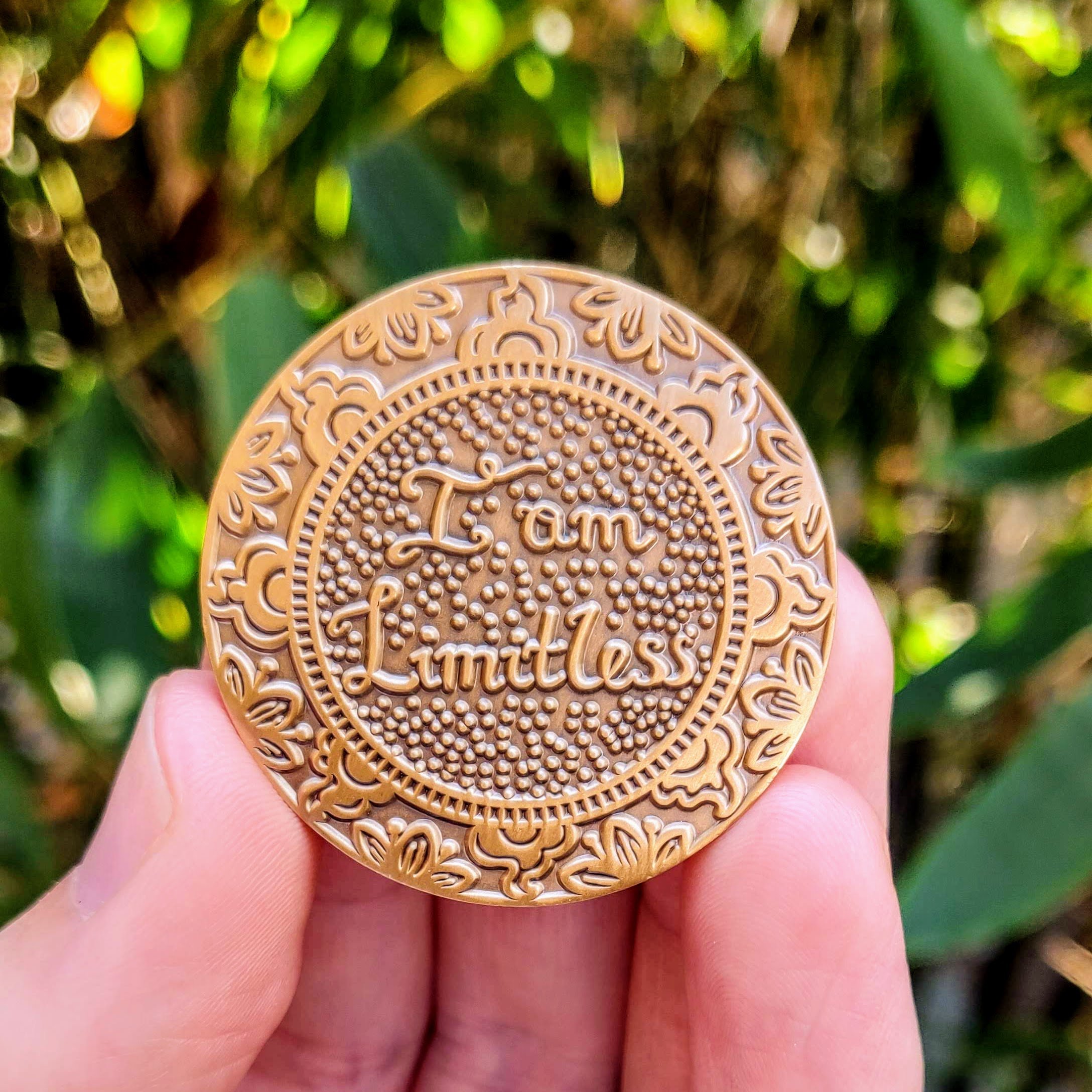 Gold I Am Limitless Mantra Medallion featuring a heart symbol, mindfulness design, and tree of life imagery, representing love and abundance.