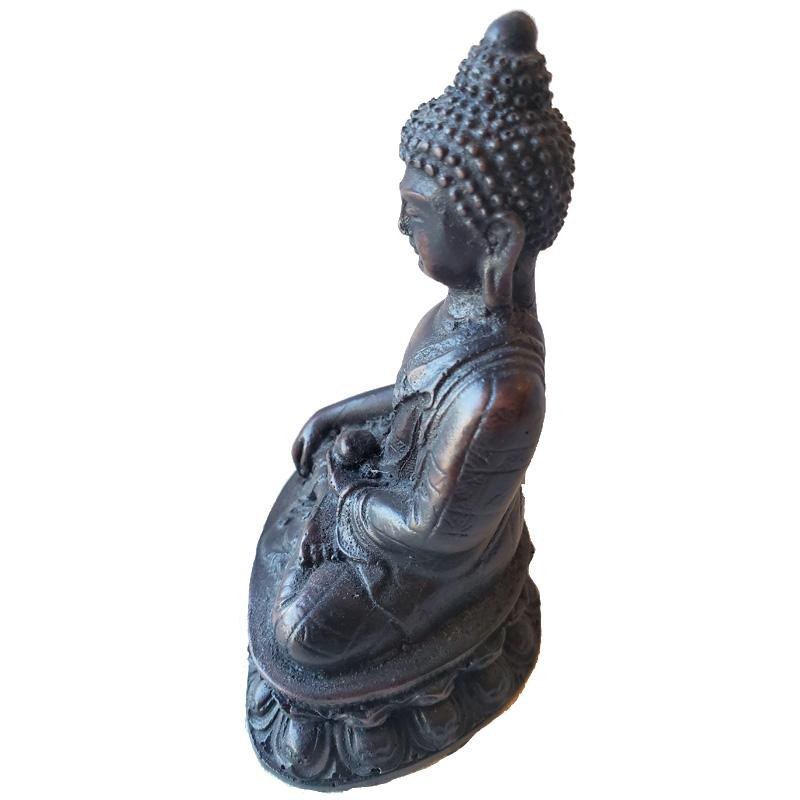 A detailed Little Buddha Resin Statue, showcasing serene features and traditional attire, perfect for meditation and home decor.