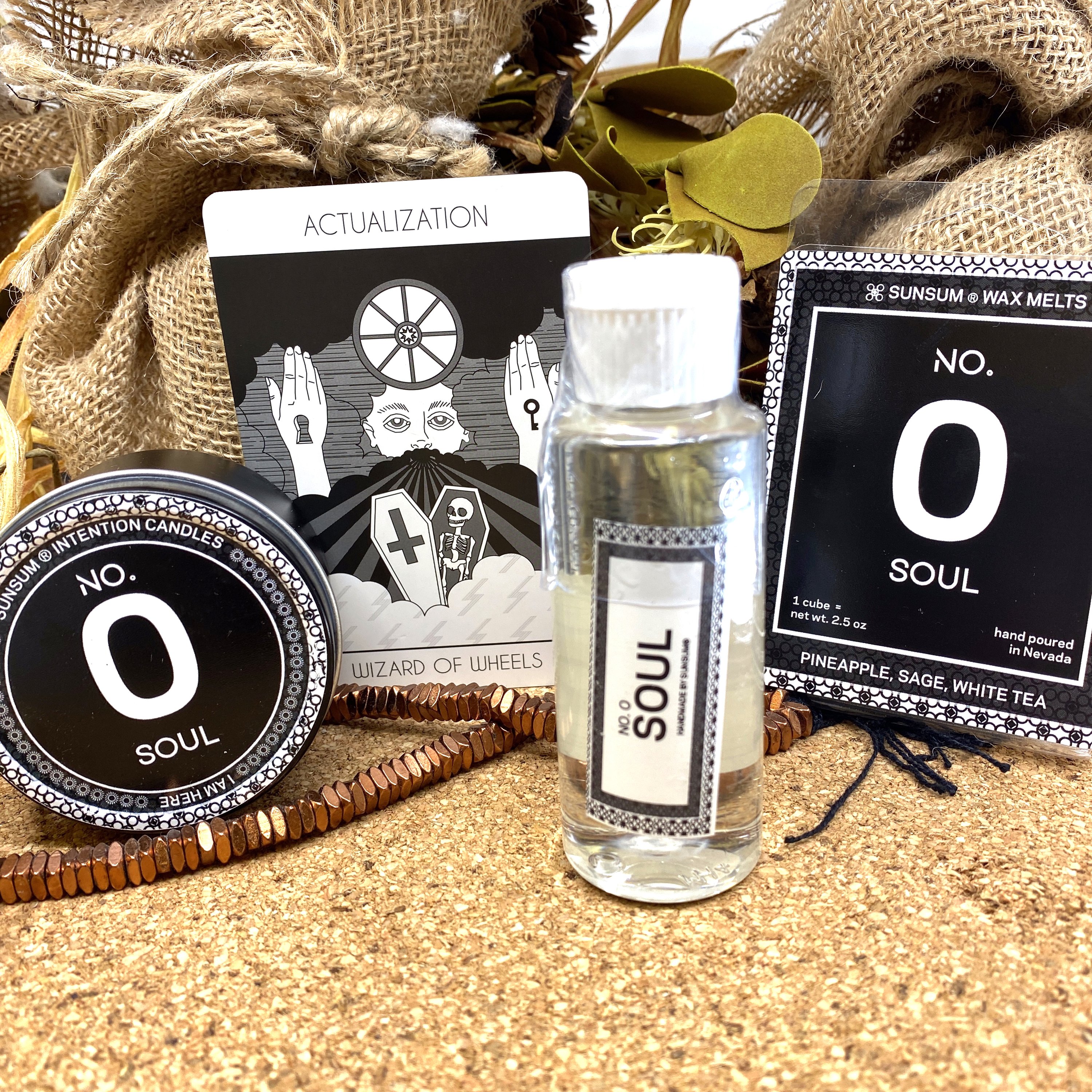 Spirit Number 000 Gift Set featuring handmade products including candles, body oils, and wax melts with aromas of pineapple, sage, and white tea.