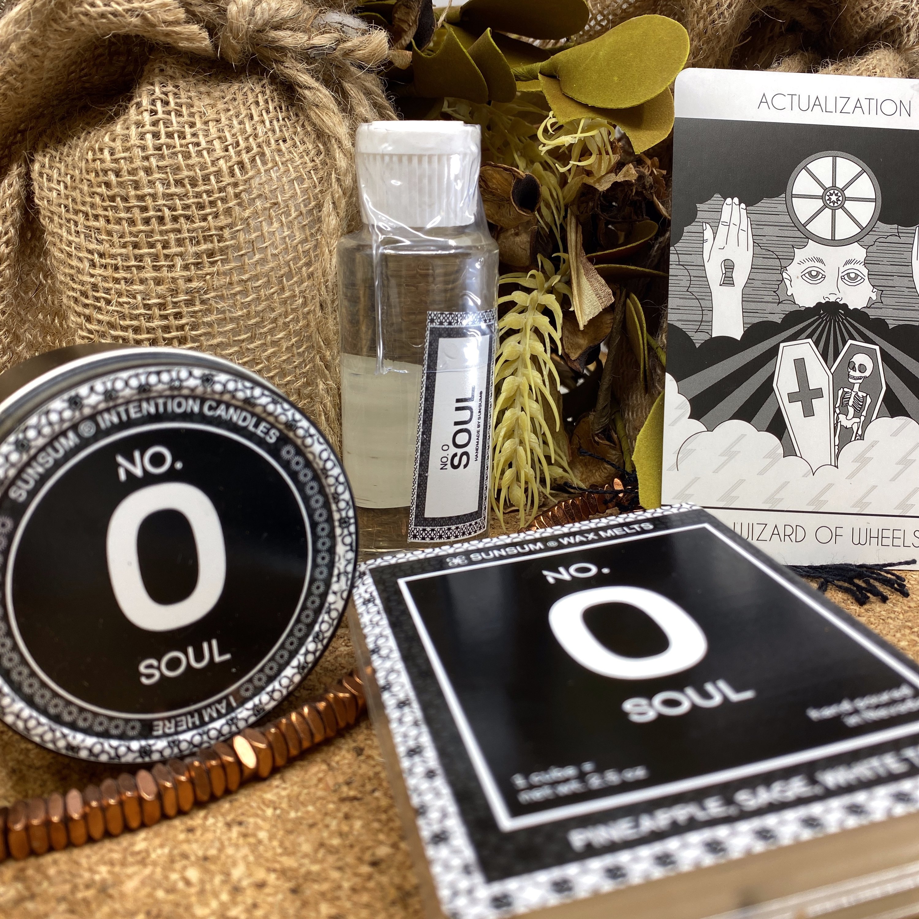 Spirit Number 000 Gift Set featuring handmade products including candles, body oils, and wax melts with aromas of pineapple, sage, and white tea.