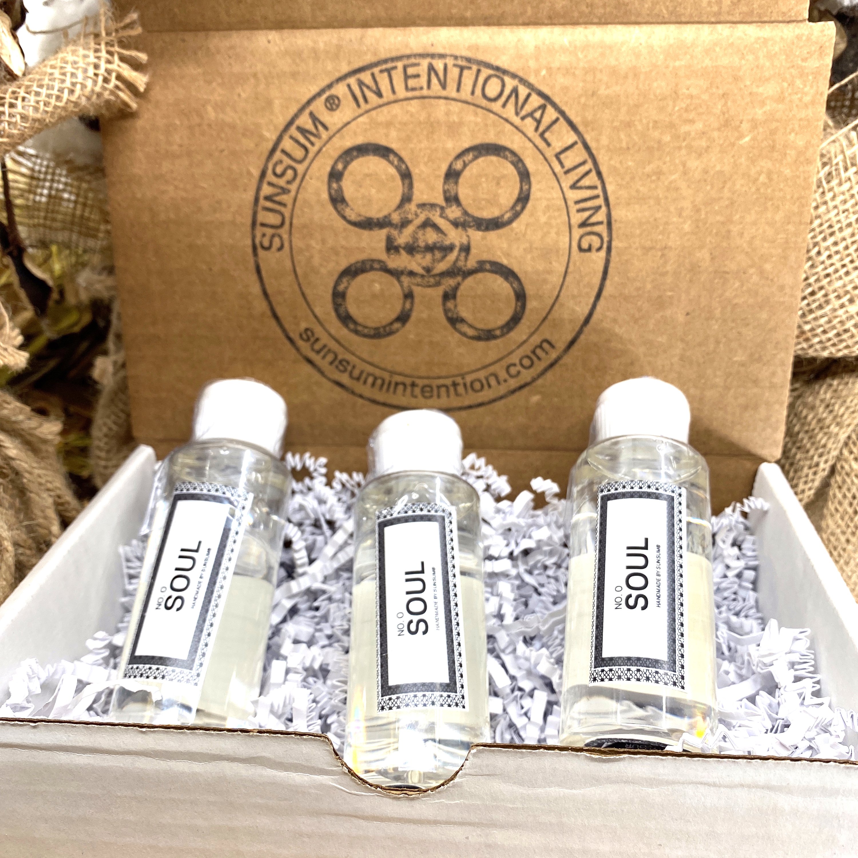 Spirit Number 000 Gift Set featuring handmade products including candles, body oils, and wax melts with aromas of pineapple, sage, and white tea.