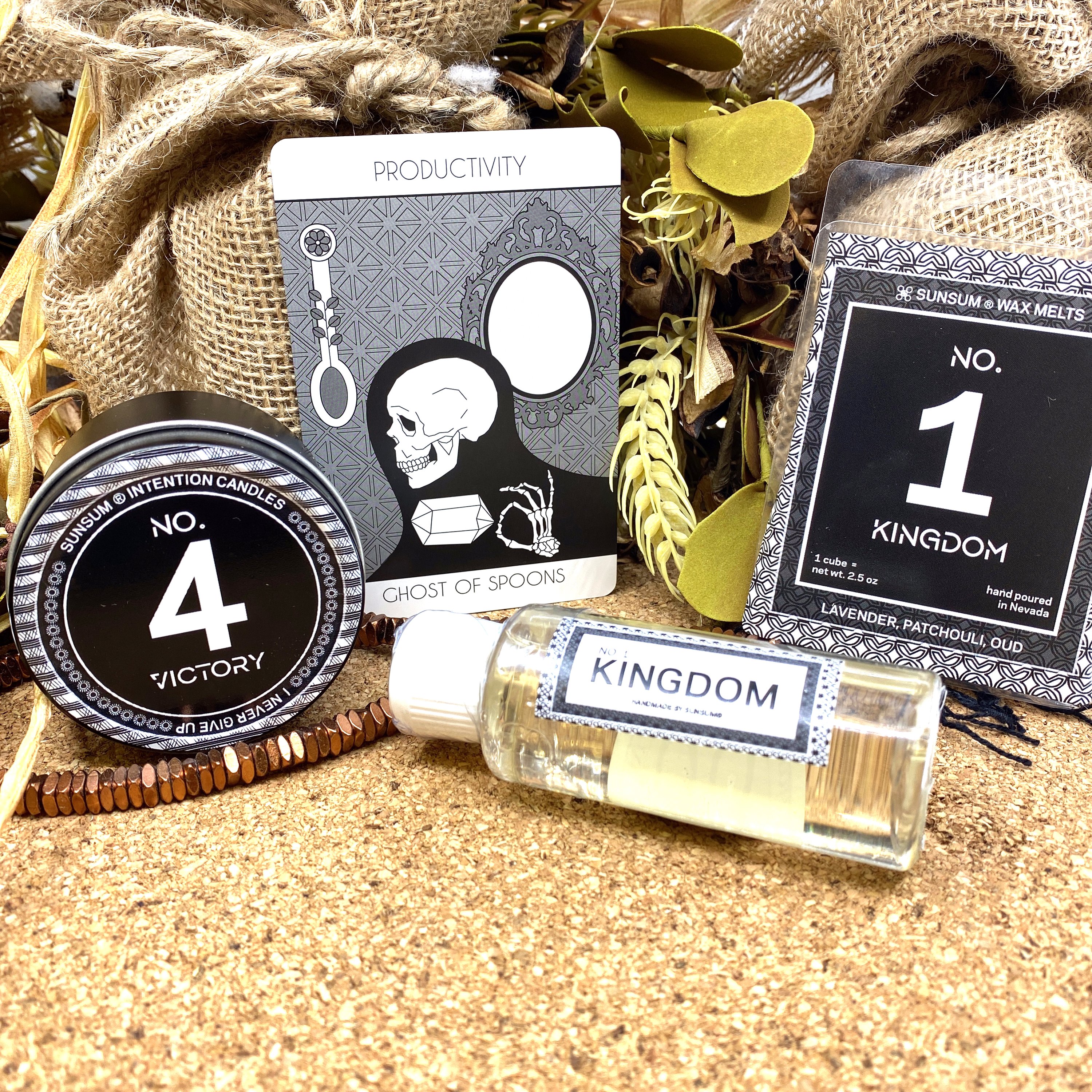 Spirit Number 411 Gift Set featuring handmade candles, body oils, and wax melts with calming aromas of amber, vanilla, lavender, and patchouli.