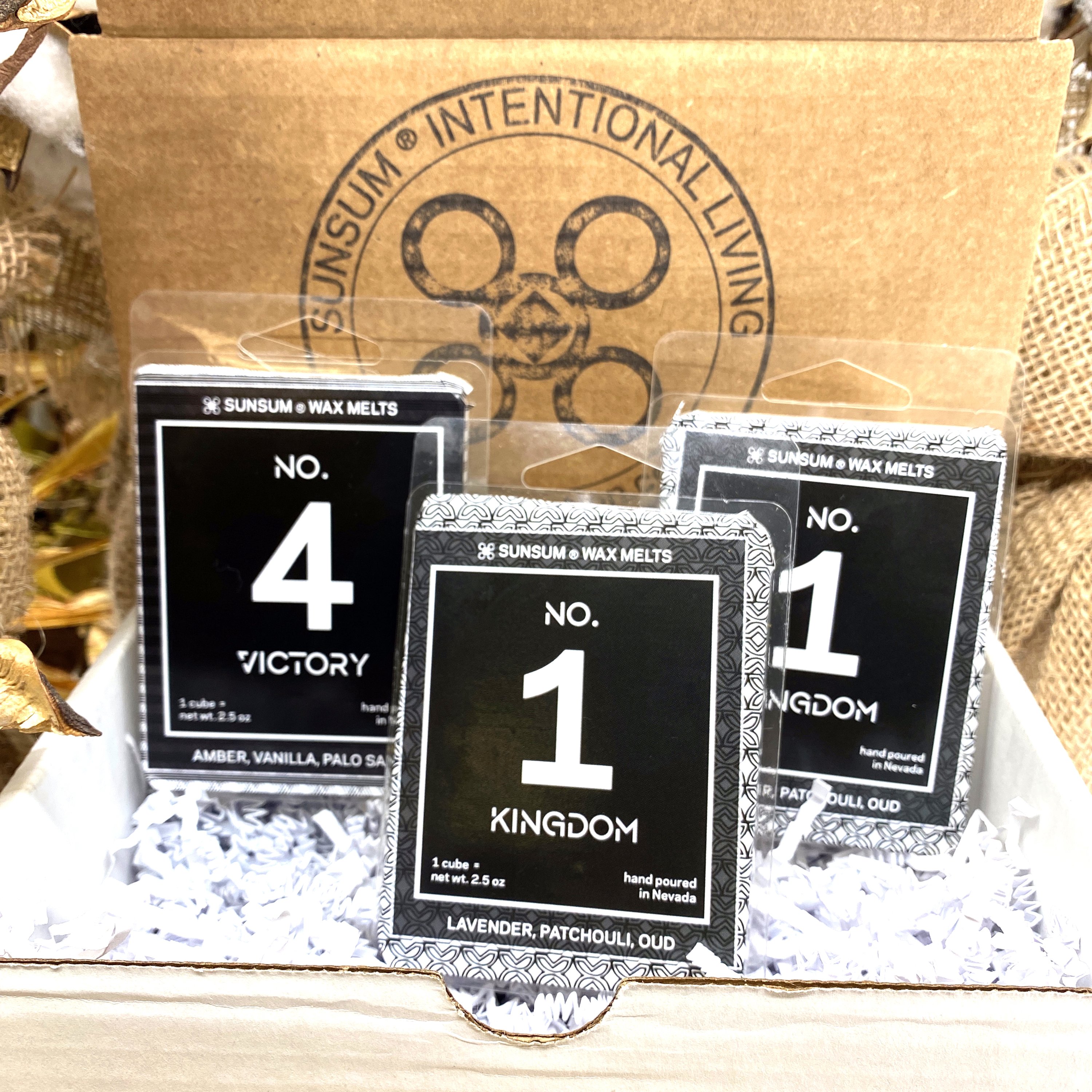 Spirit Number 411 Gift Set featuring handmade candles, body oils, and wax melts with calming aromas of amber, vanilla, lavender, and patchouli.