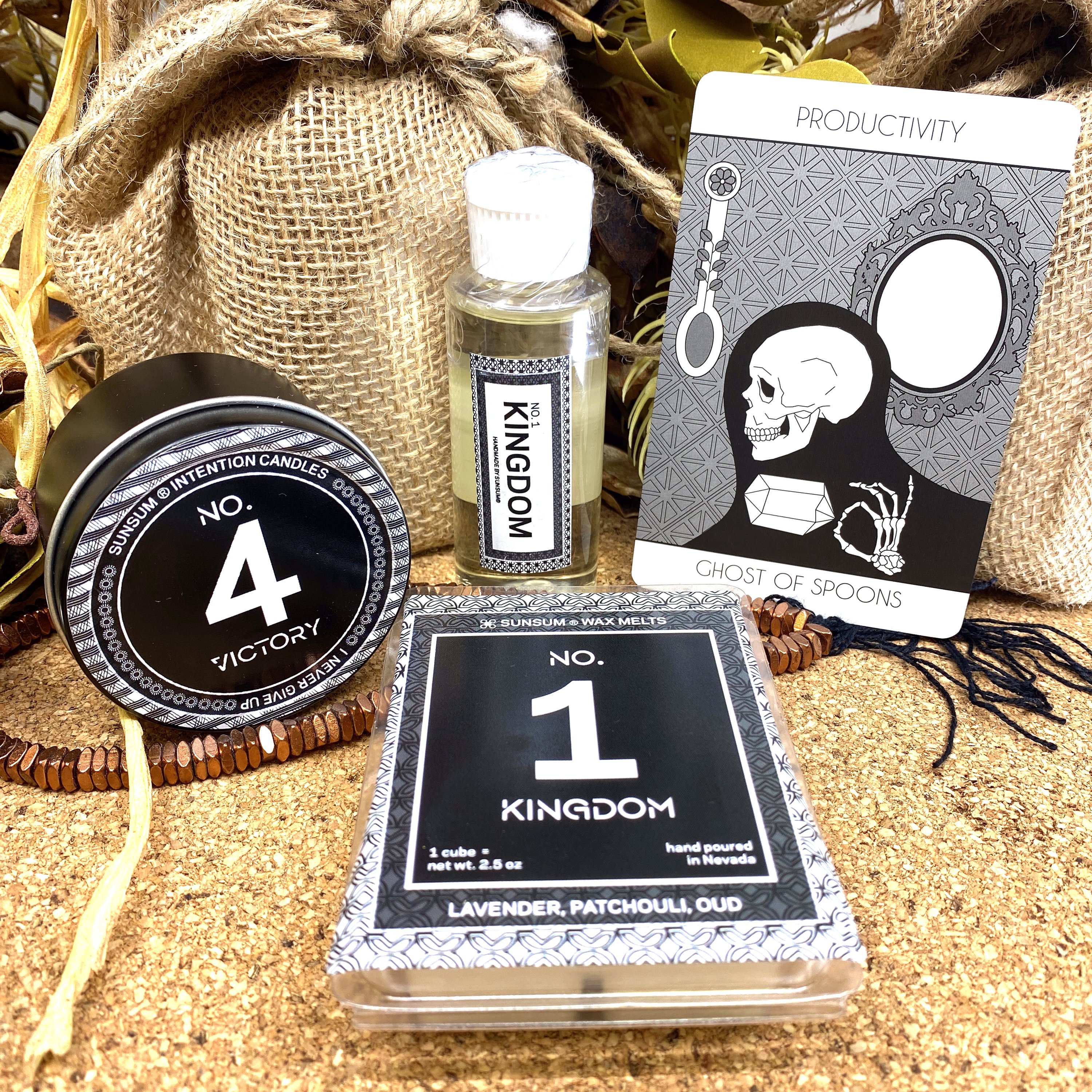 Spirit Number 411 Gift Set featuring handmade candles, body oils, and wax melts with calming aromas of amber, vanilla, lavender, and patchouli.