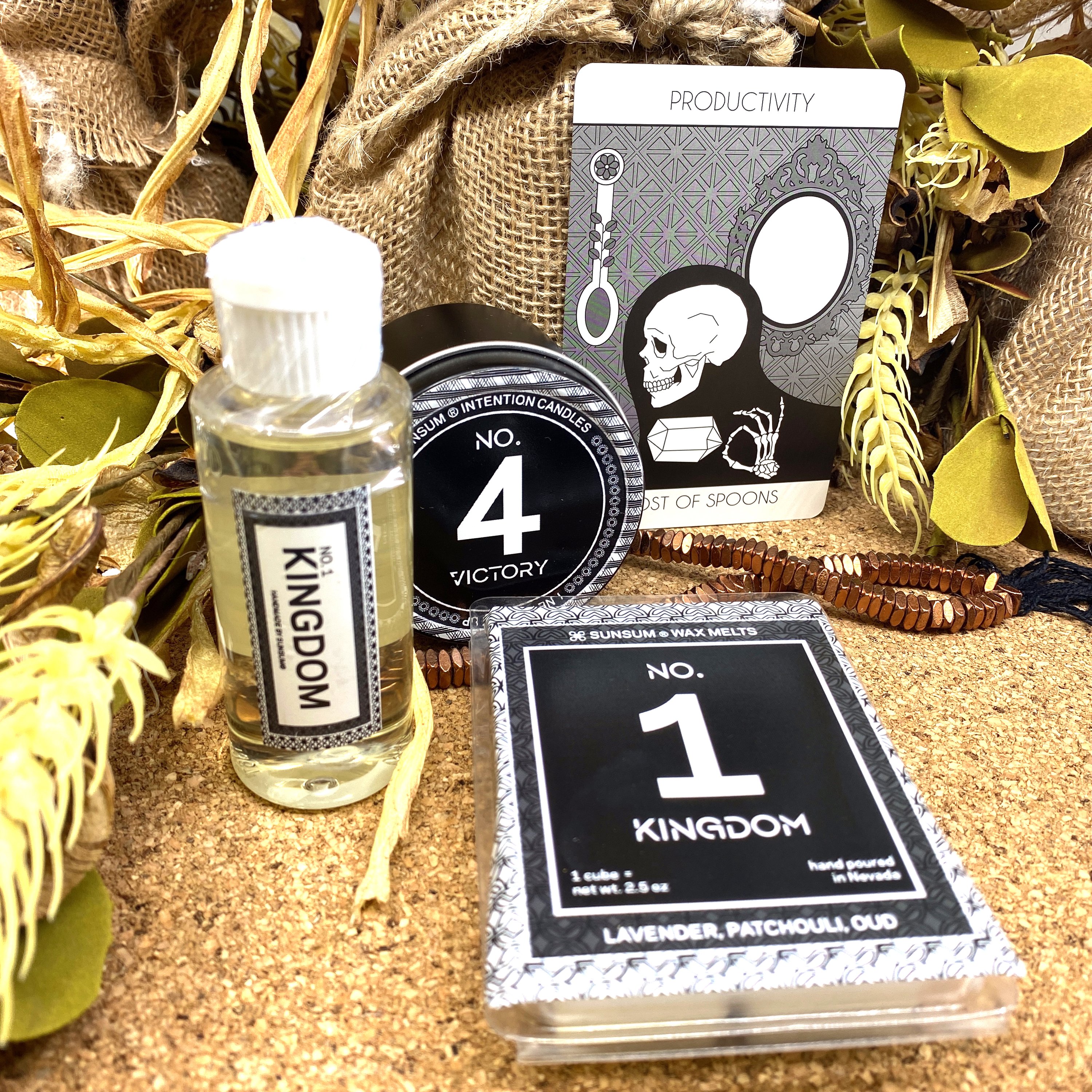 Spirit Number 411 Gift Set featuring handmade candles, body oils, and wax melts with calming aromas of amber, vanilla, lavender, and patchouli.