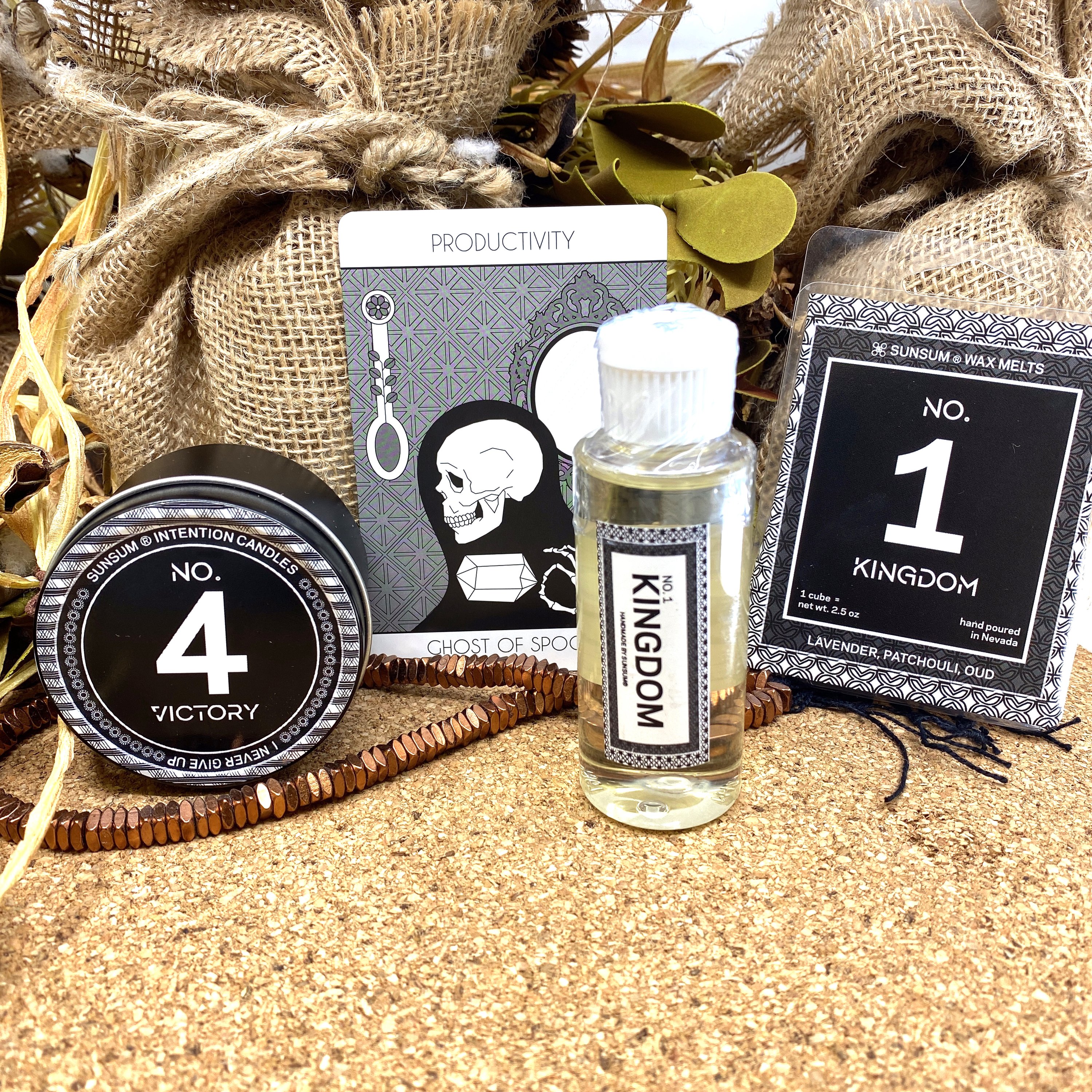 Spirit Number 411 Gift Set featuring handmade candles, body oils, and wax melts with calming aromas of amber, vanilla, lavender, and patchouli.