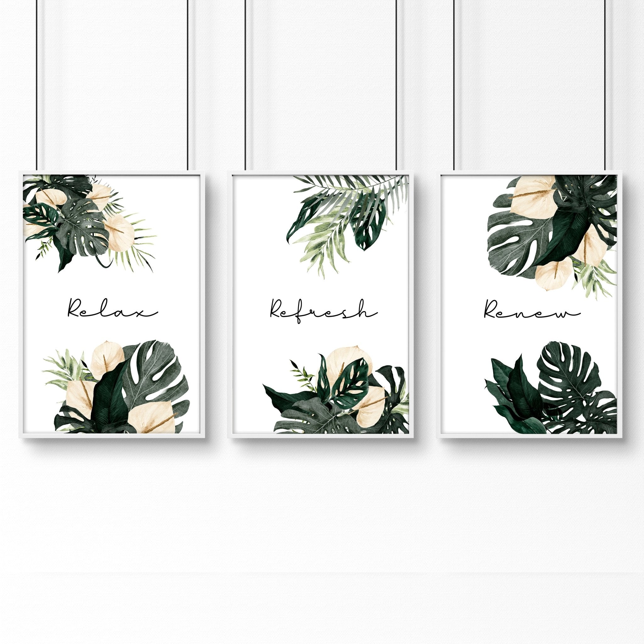 Set of 3 tropical wall art prints featuring vibrant monstera leaves and flowers with calming quotes, perfect for bathroom decor.