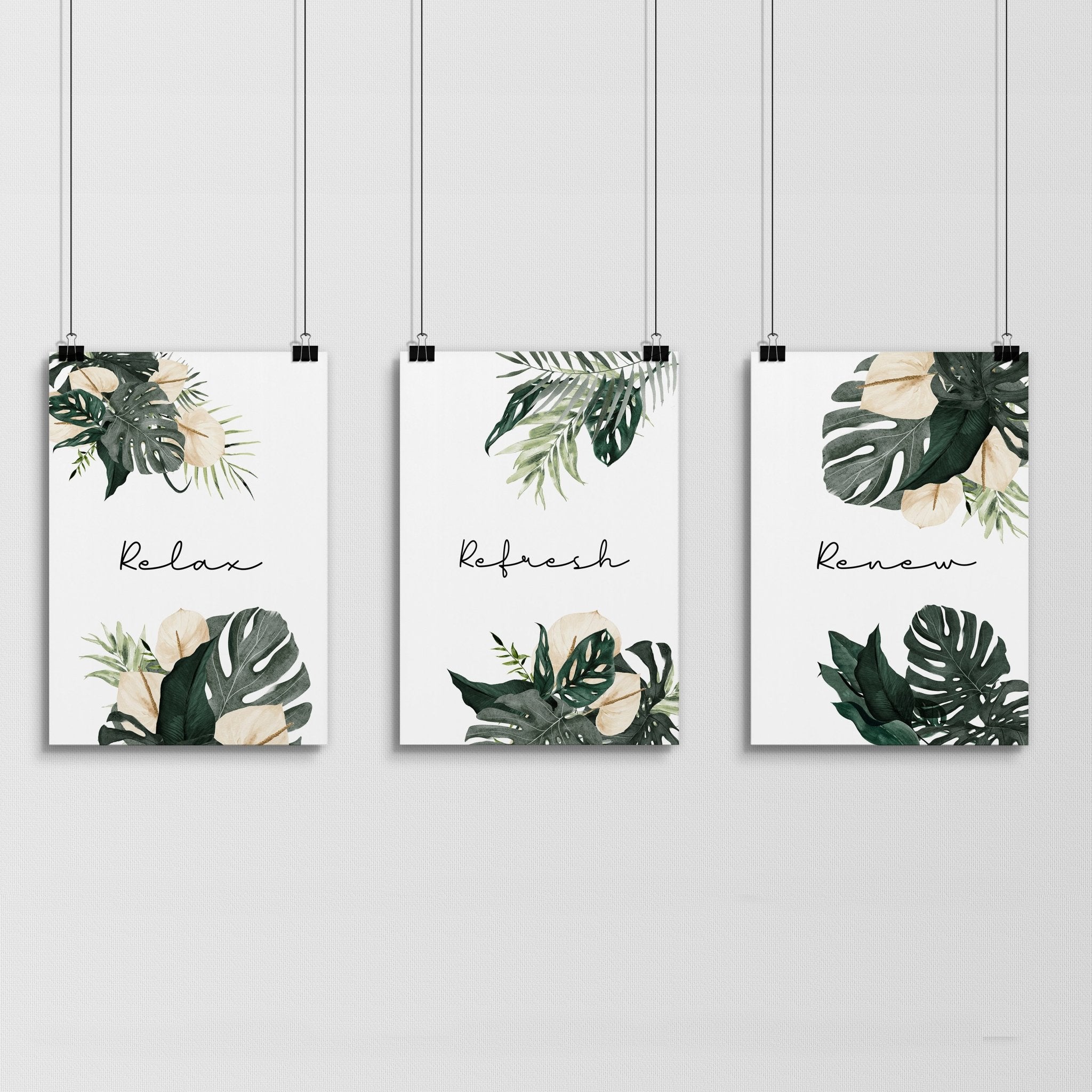 Set of 3 tropical wall art prints featuring vibrant monstera leaves and flowers with calming quotes, perfect for bathroom decor.