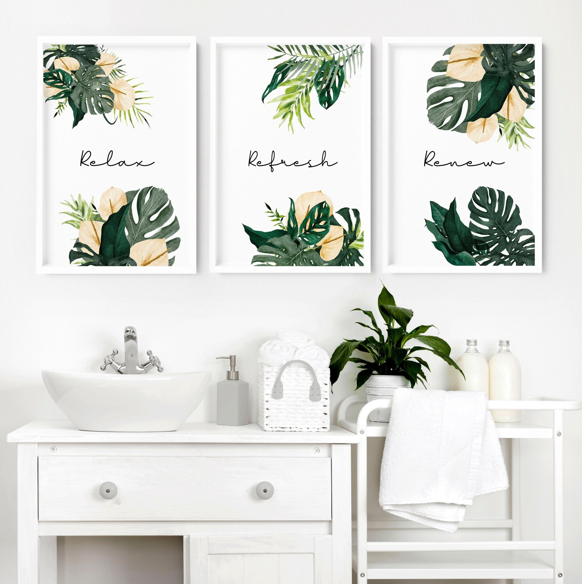 Set of 3 tropical wall art prints featuring vibrant monstera leaves and flowers with calming quotes, perfect for bathroom decor.