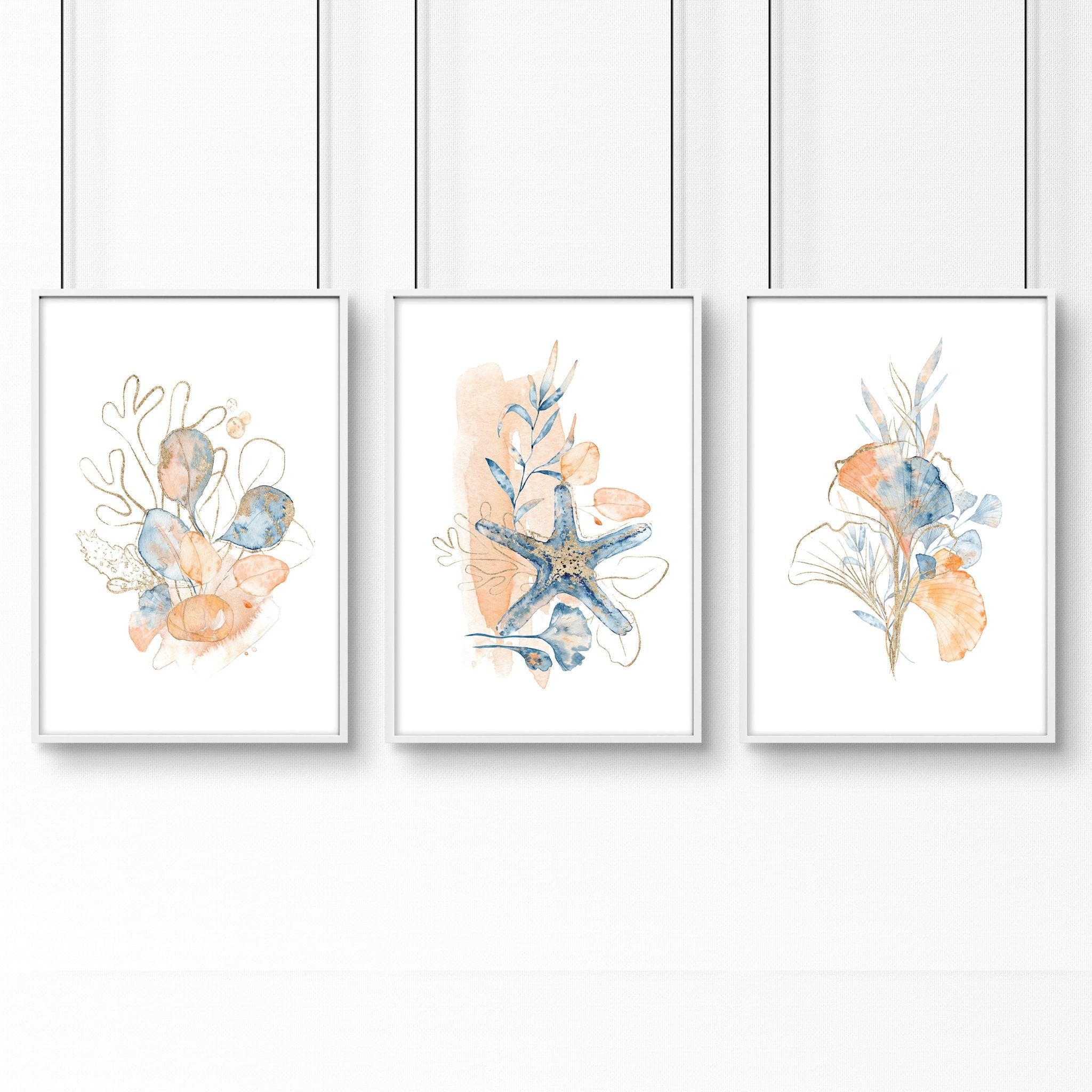 Set of 3 coastal-themed wall art prints featuring muted tones of blue, blush pink, and red, designed for bathroom decor.