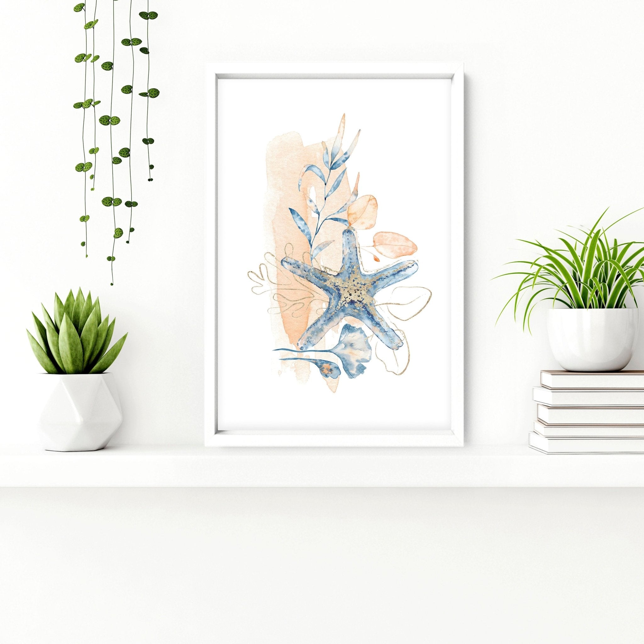 Set of 3 coastal-themed wall art prints featuring muted tones of blue, blush pink, and red, designed for bathroom decor.