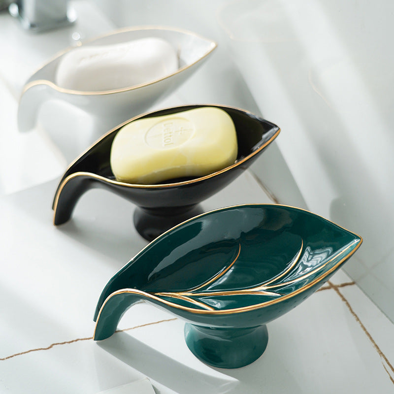 Ceramics Leaf Shape Soap Box in elegant leaf design, made of durable ceramic with a suction cup base for stability.