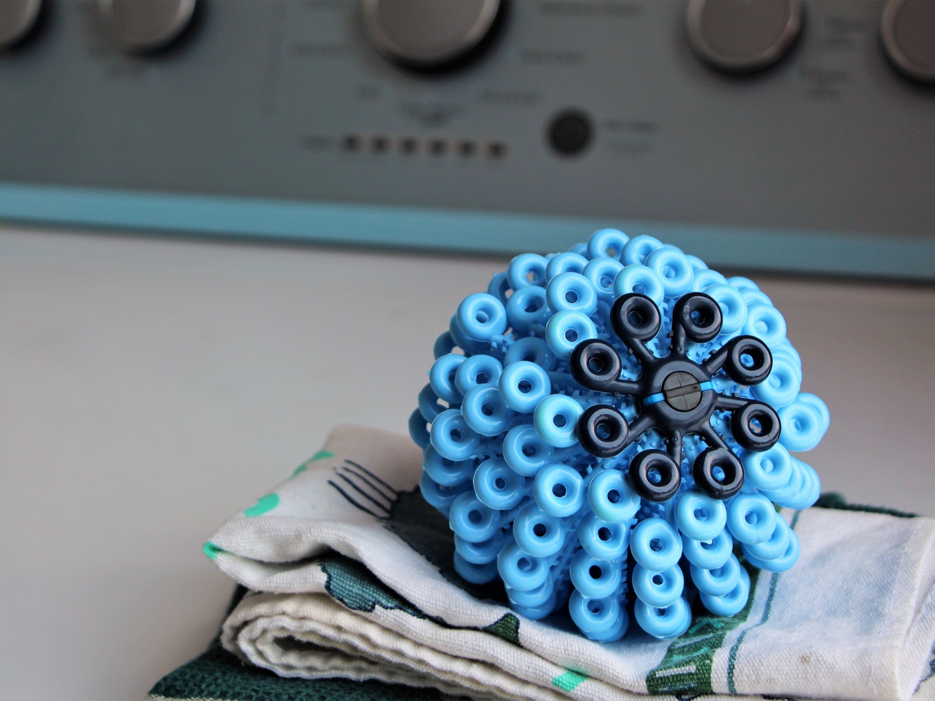 Cora Ball laundry ball designed to collect microfibers during washing, promoting ocean conservation.