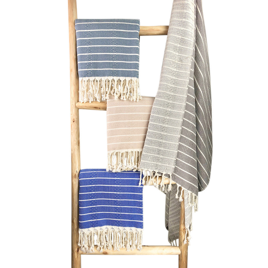 Geo Stripe Turkish Towel showcasing vibrant patterns and textures, perfect for bath, beach, and travel use.