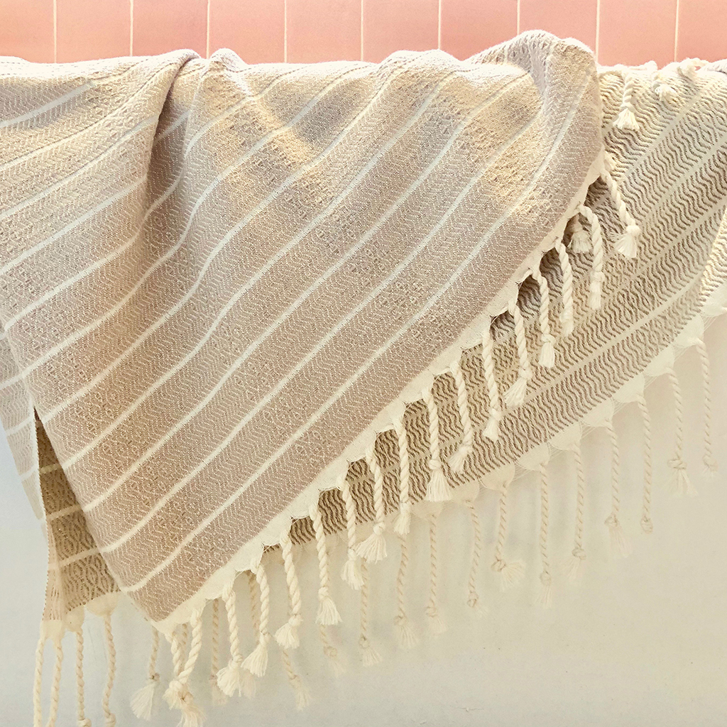 Geo Stripe Turkish Towel showcasing vibrant patterns and textures, perfect for bath, beach, and travel use.