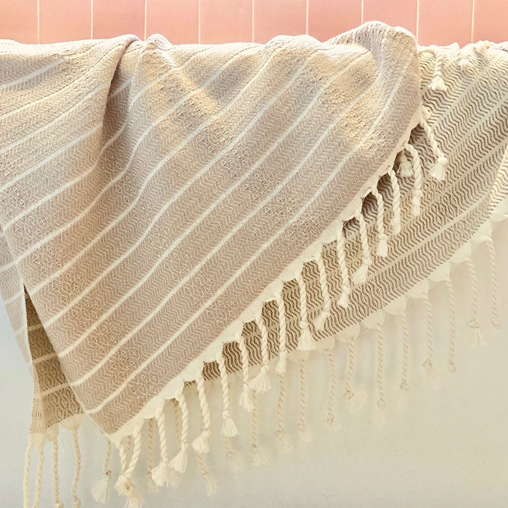 Geo Stripe Turkish Towel showcasing vibrant patterns and textures, perfect for bath, beach, and travel use.